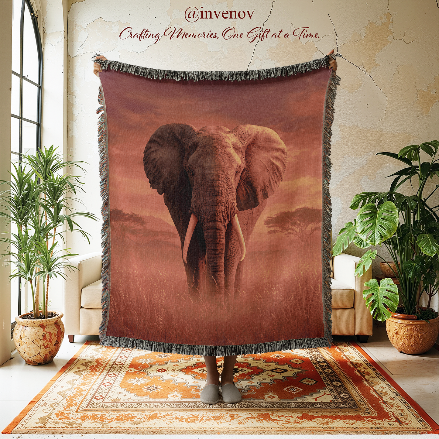 Blanket with an elephant design in a room with plants and furniture.