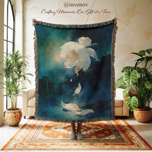 Decorative throw blanket with floral design in a room with plants and furniture.