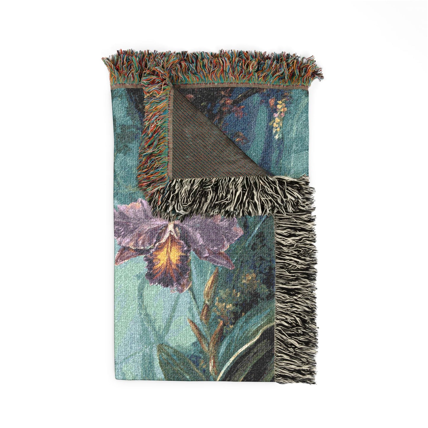 Decorative blanket with floral design and fringed edges on a white background
