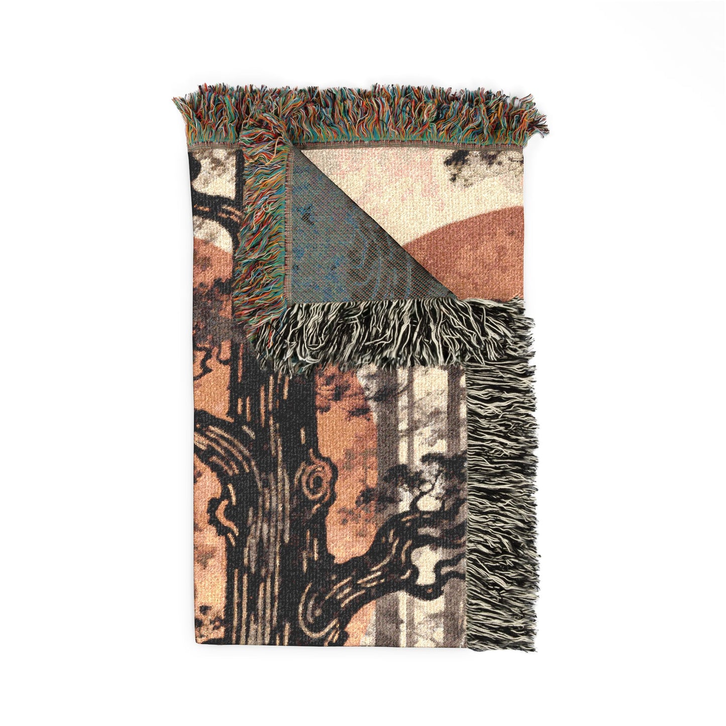 Decorative blanket with abstract patterns and fringes on a white background