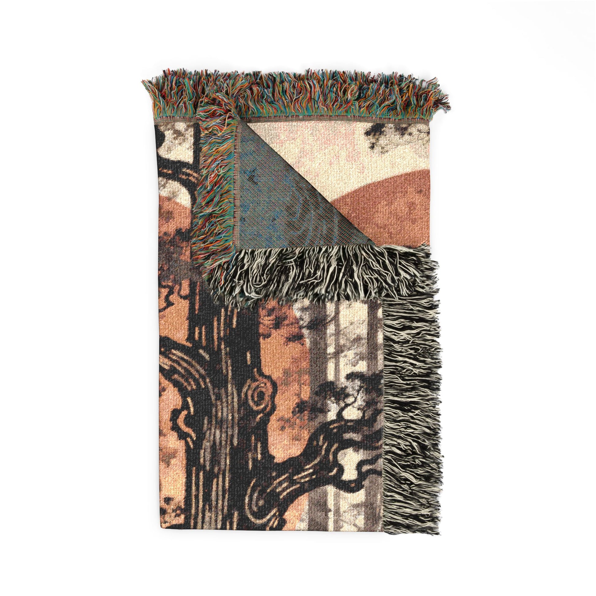 Decorative blanket with abstract patterns and fringes on a white background