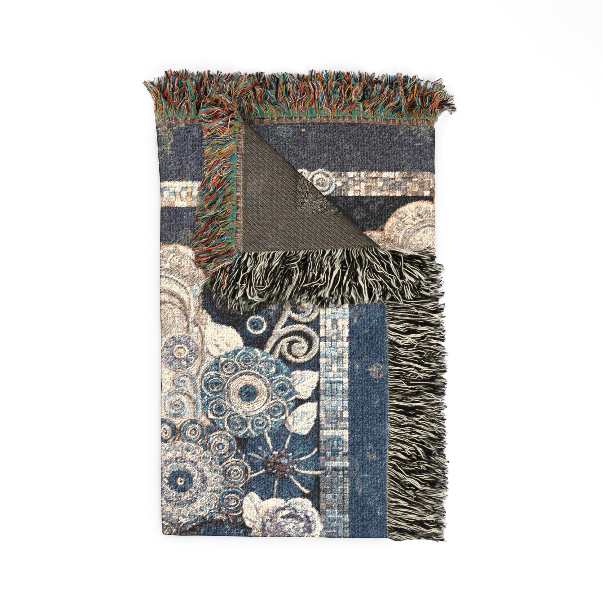 Decorative blanket with floral patterns and fringed edges on a white background