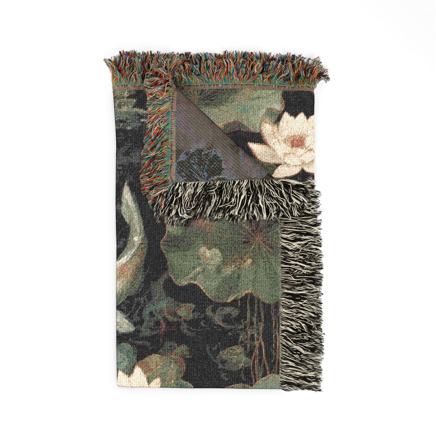 Decorative blanket with floral patterns and fringed edges on a white background