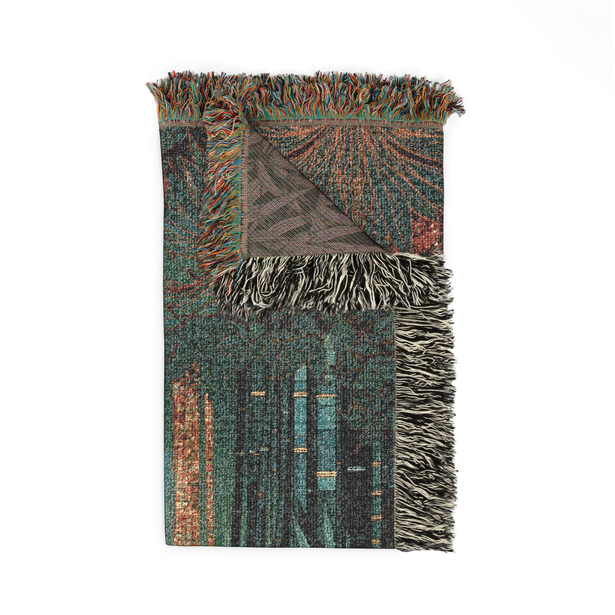 A rectangular woven throw blanket with fringed edges, featuring an abstract geometric pattern in teal, brown, rust, and black, shown on a plain white background.