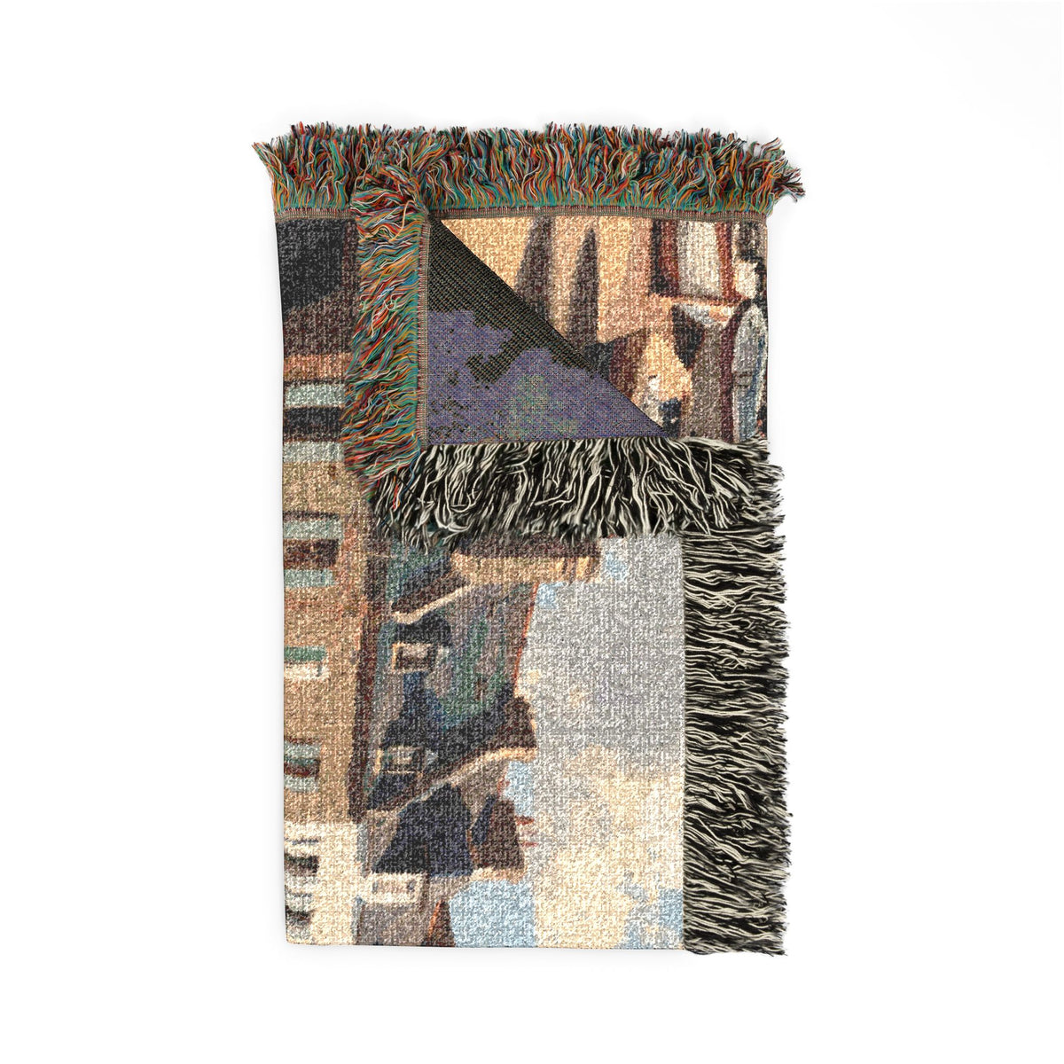 A woven throw blanket with a multicolor cityscape pattern and fringed edges, displayed flat against a solid white background.