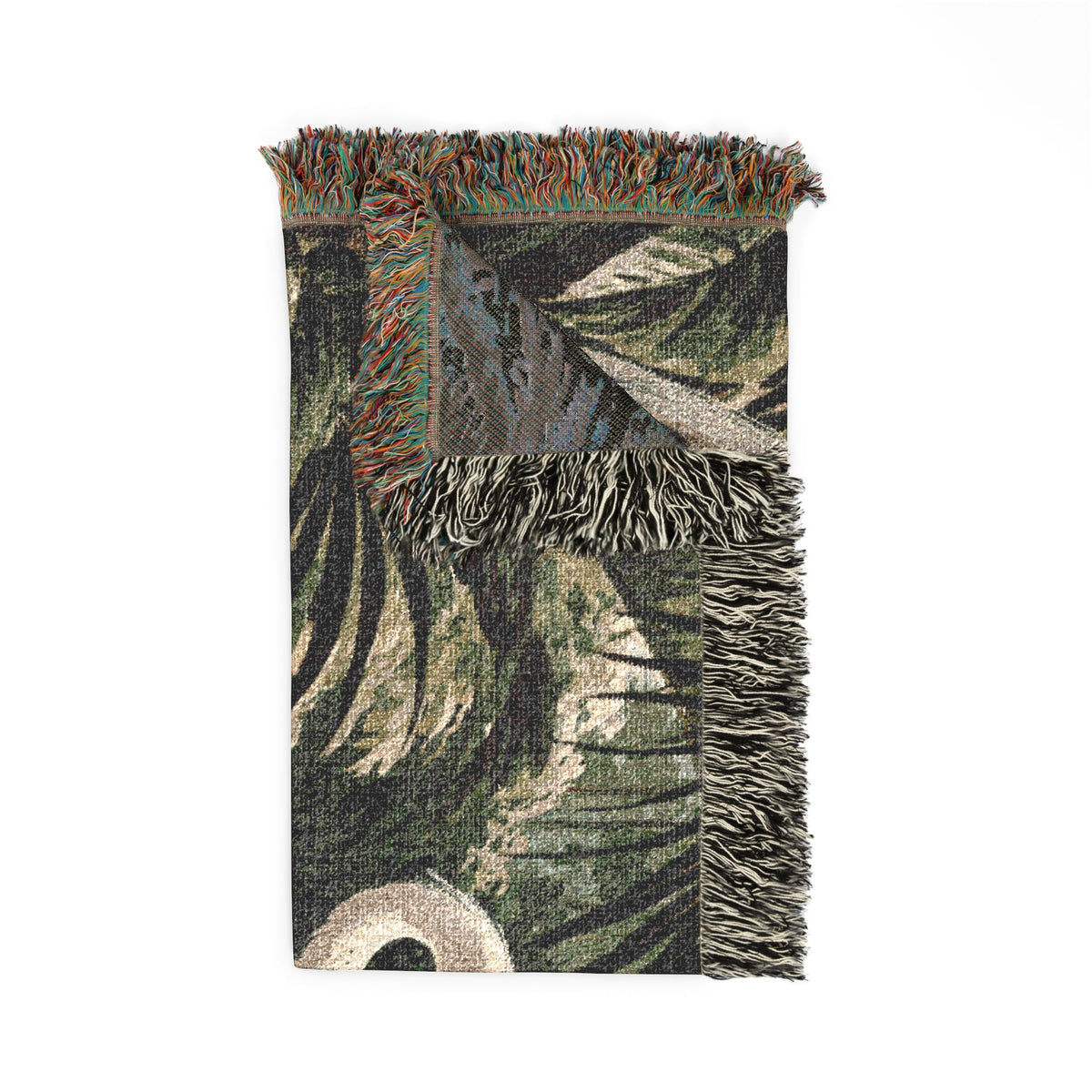 A woven throw blanket featuring a botanical leaf pattern in shades of green, beige, and brown, finished with fringed edges.