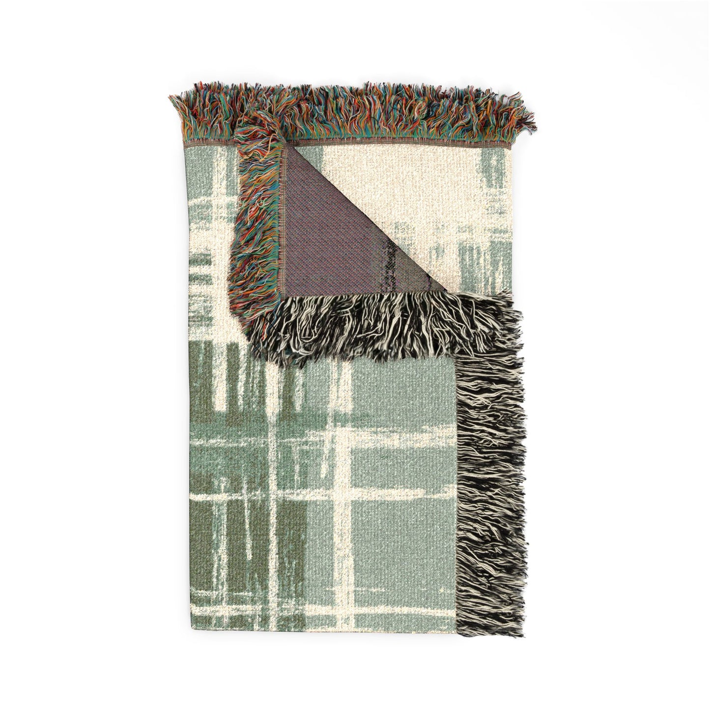 Plaid blanket with fringe edges on a white background