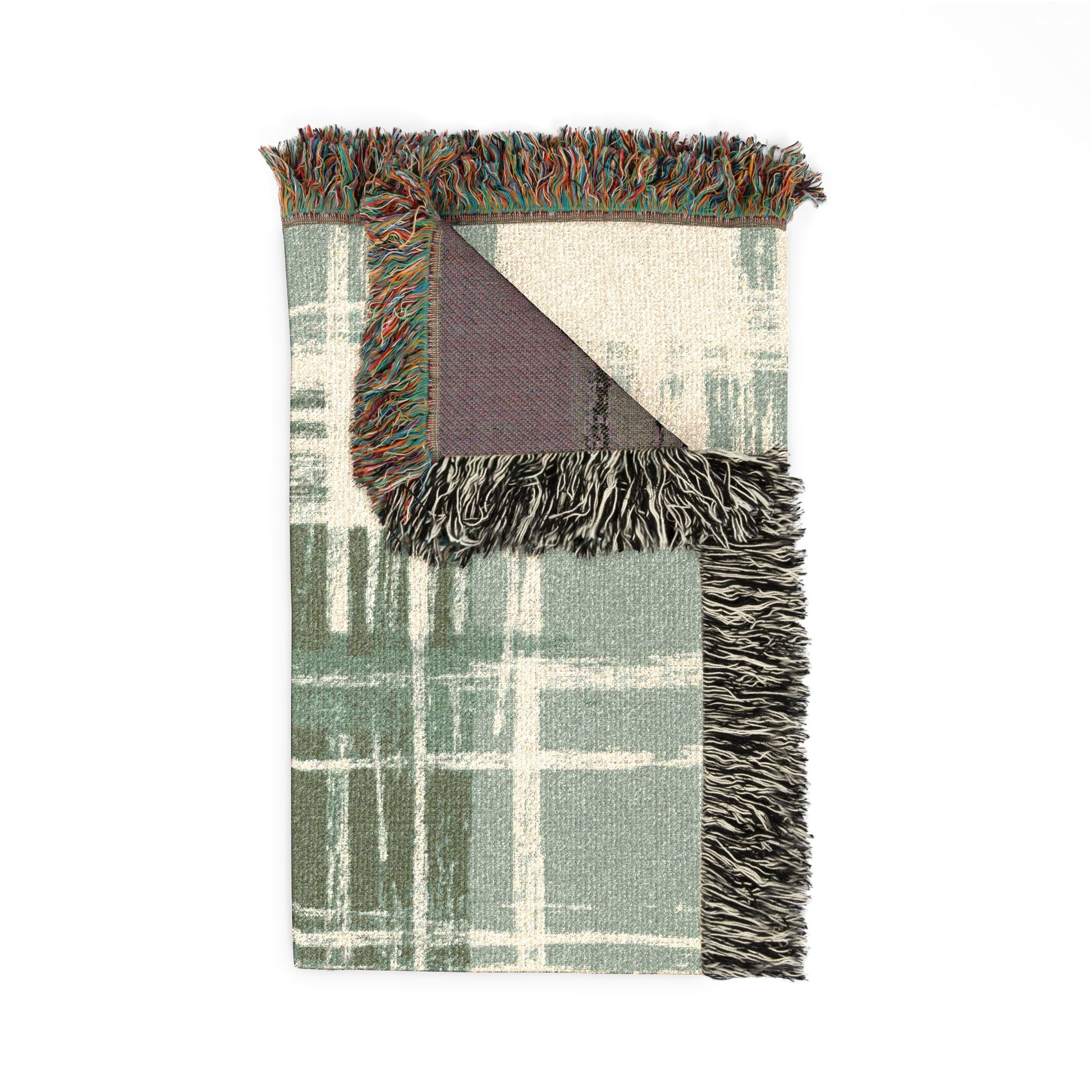 Plaid blanket with fringe edges on a white background