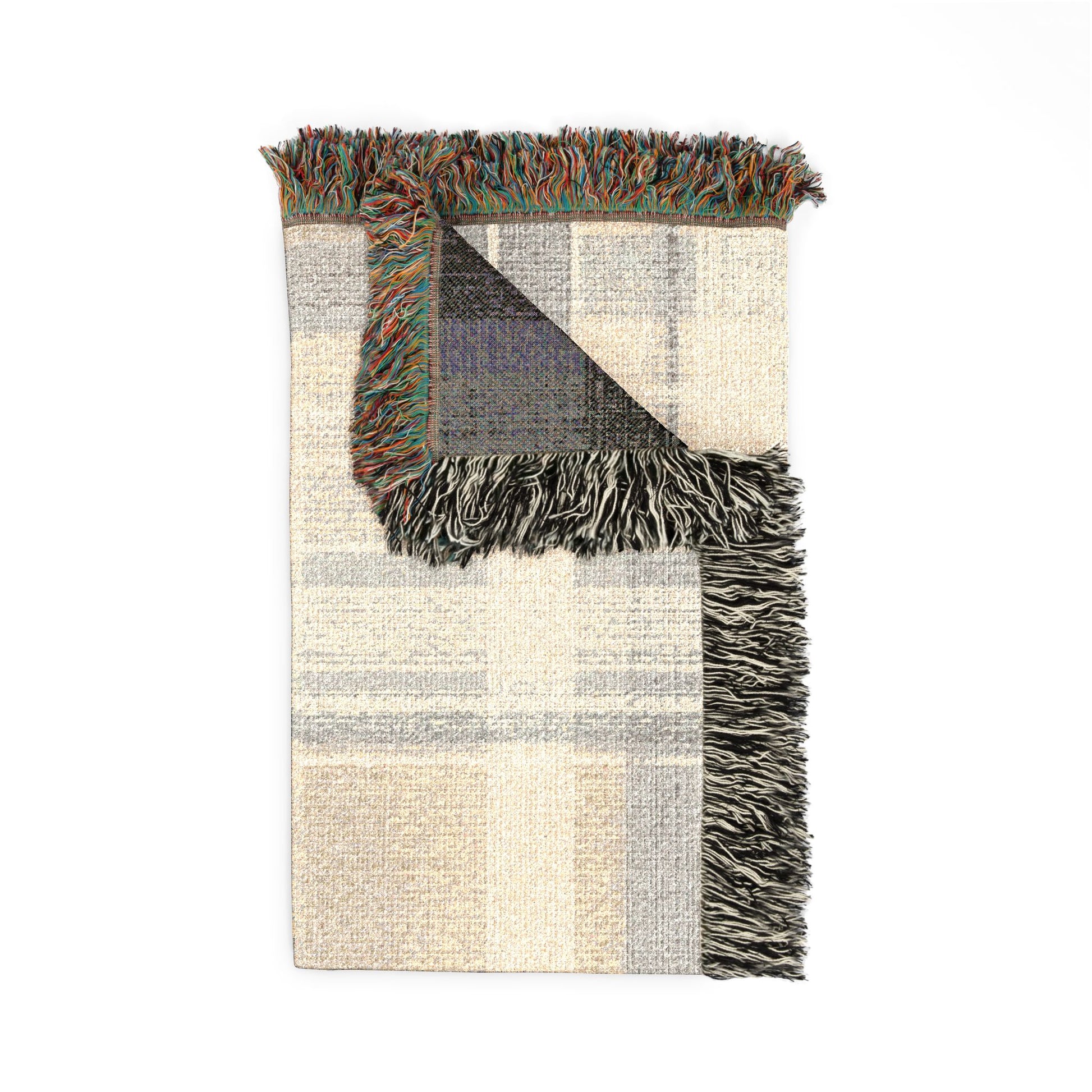 Floral-patterned blanket with fringe on a white background