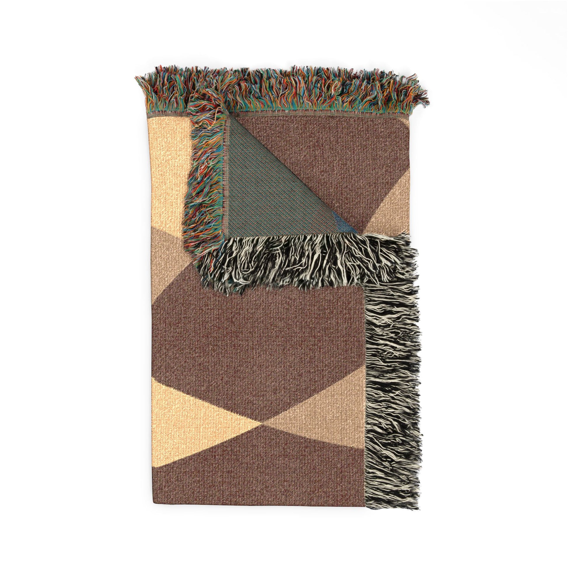Geometric patterned blanket with fringes on a white background