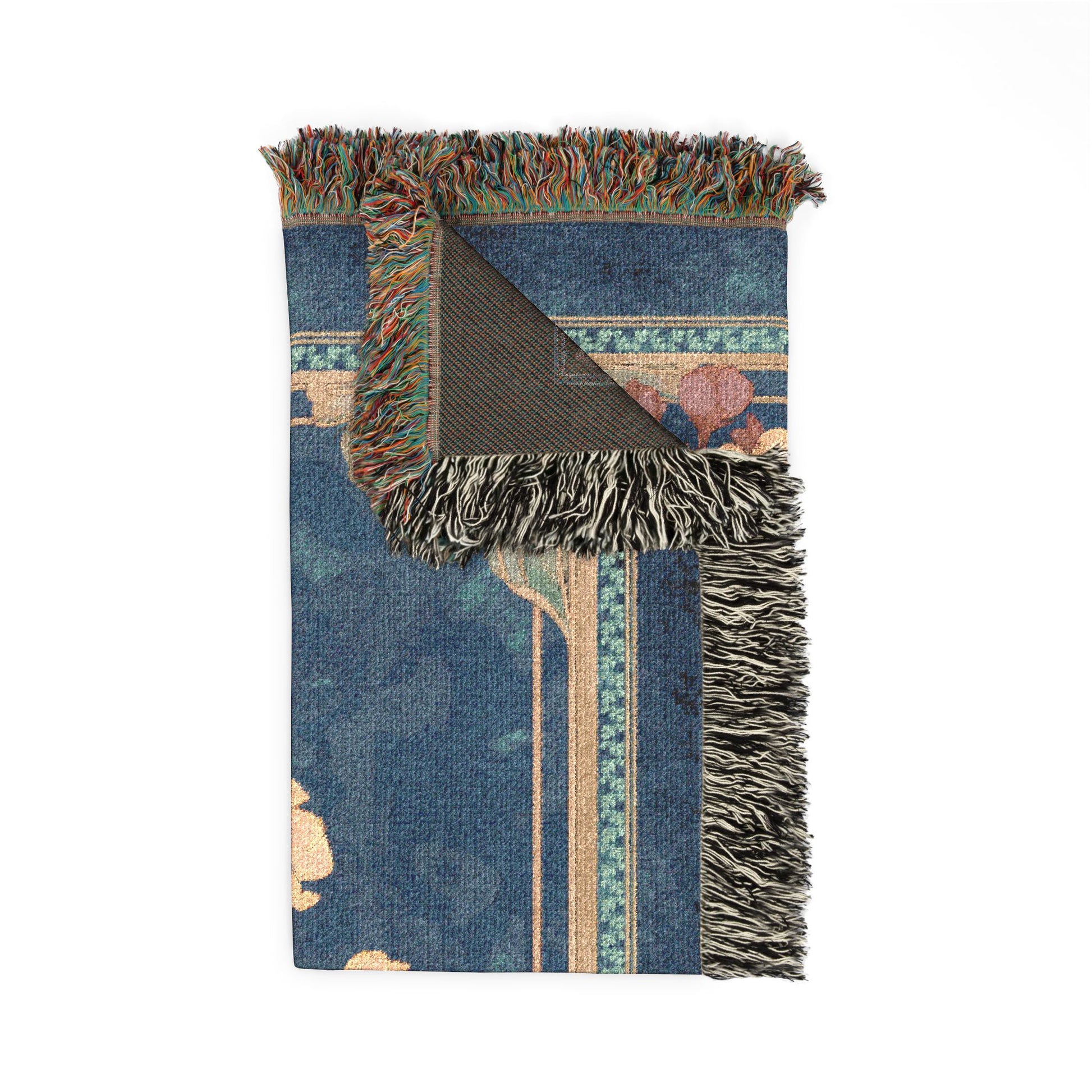 Blue patterned blanket with fringed edges on a white background