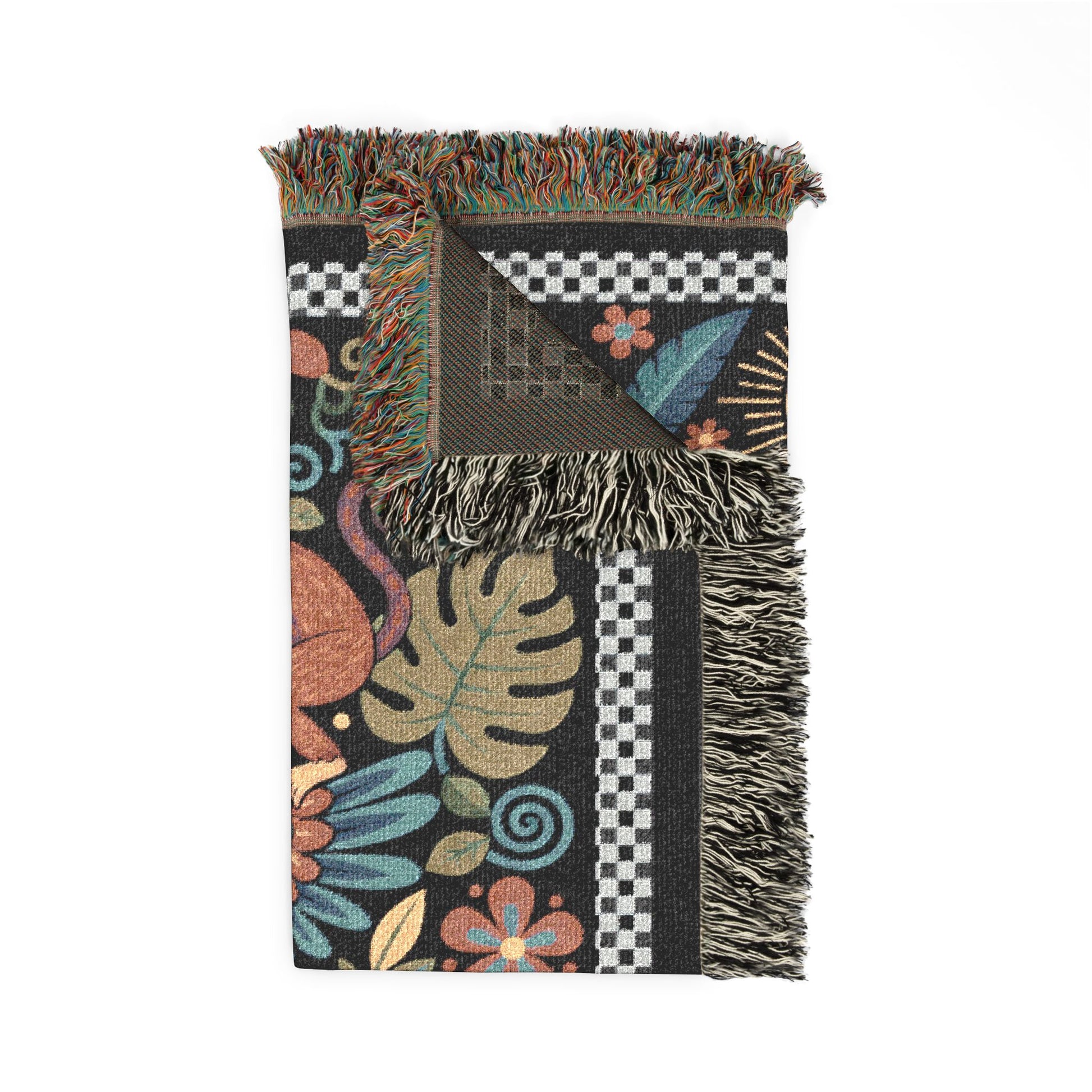 Colorful patterned blanket with fringes on a white background