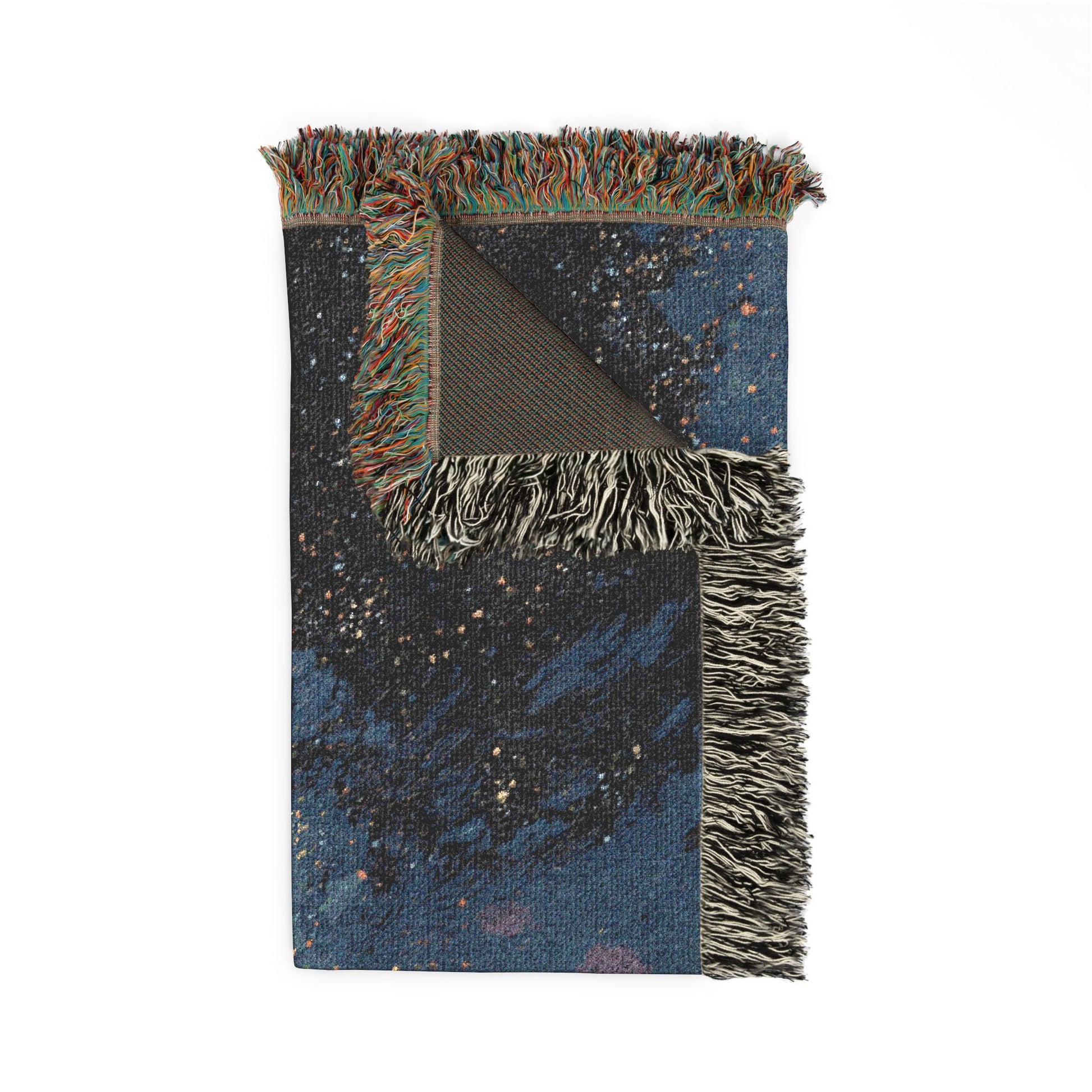 Woven blanket with starry night design and fringed edges on a white background