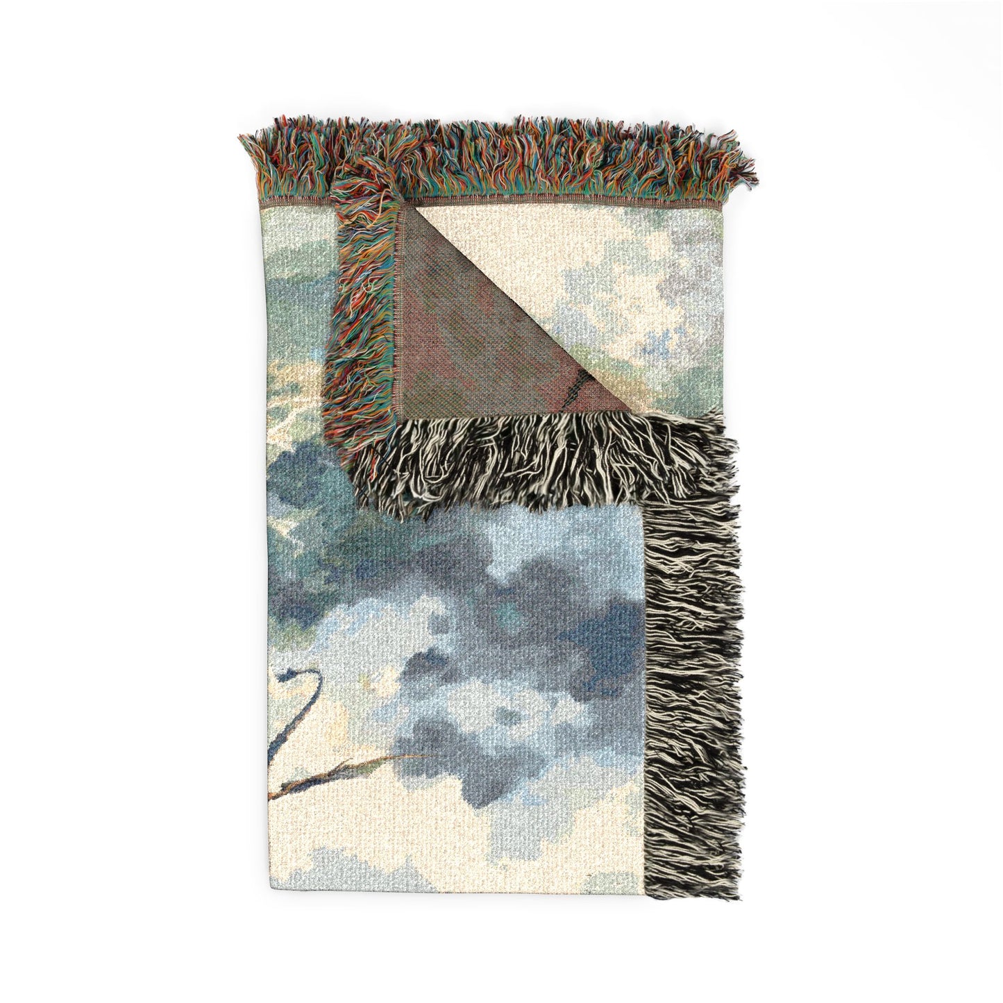 Decorative blanket with geometric pattern and fringed edges on a white background