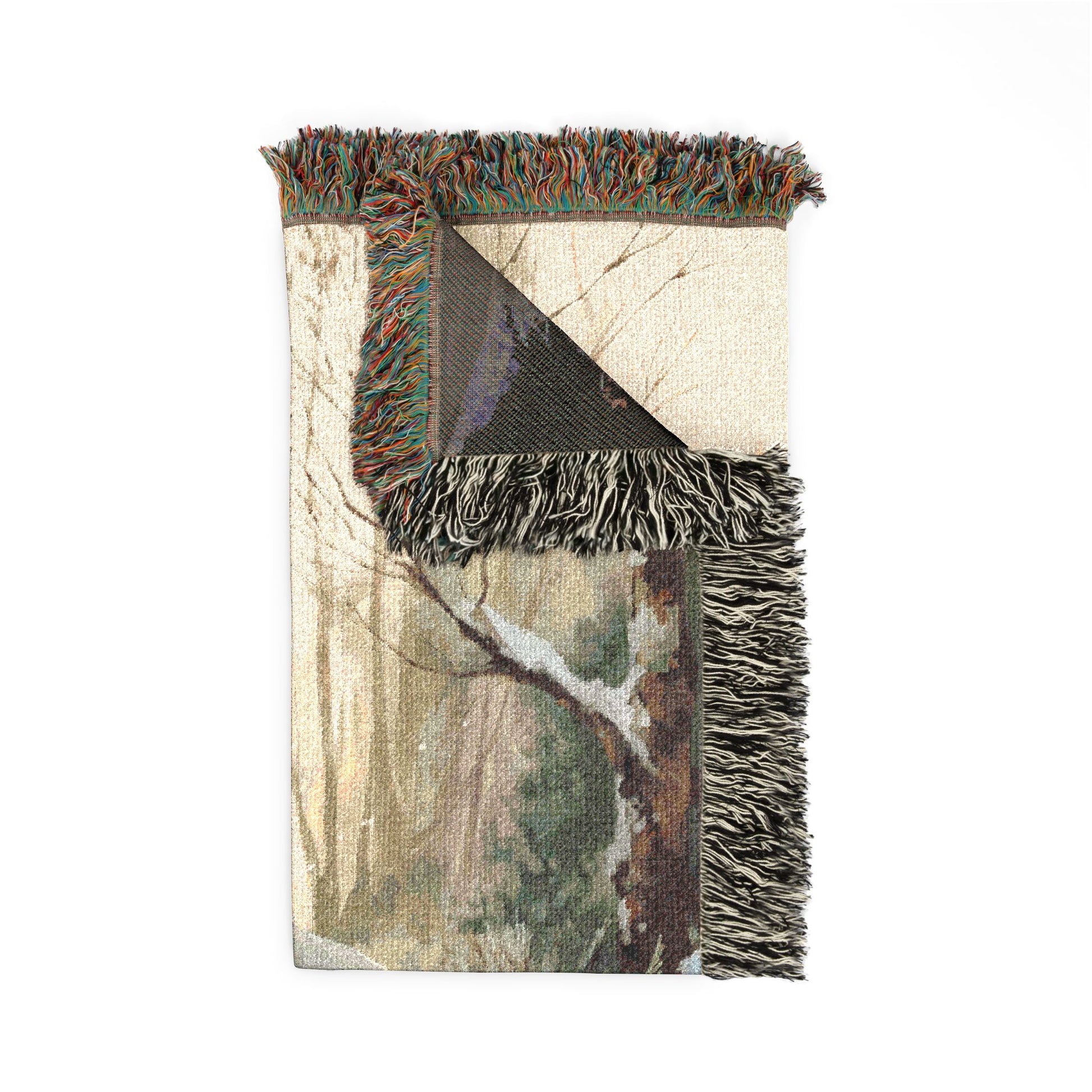 Camouflage-patterned throw blanket with fringes on a white background