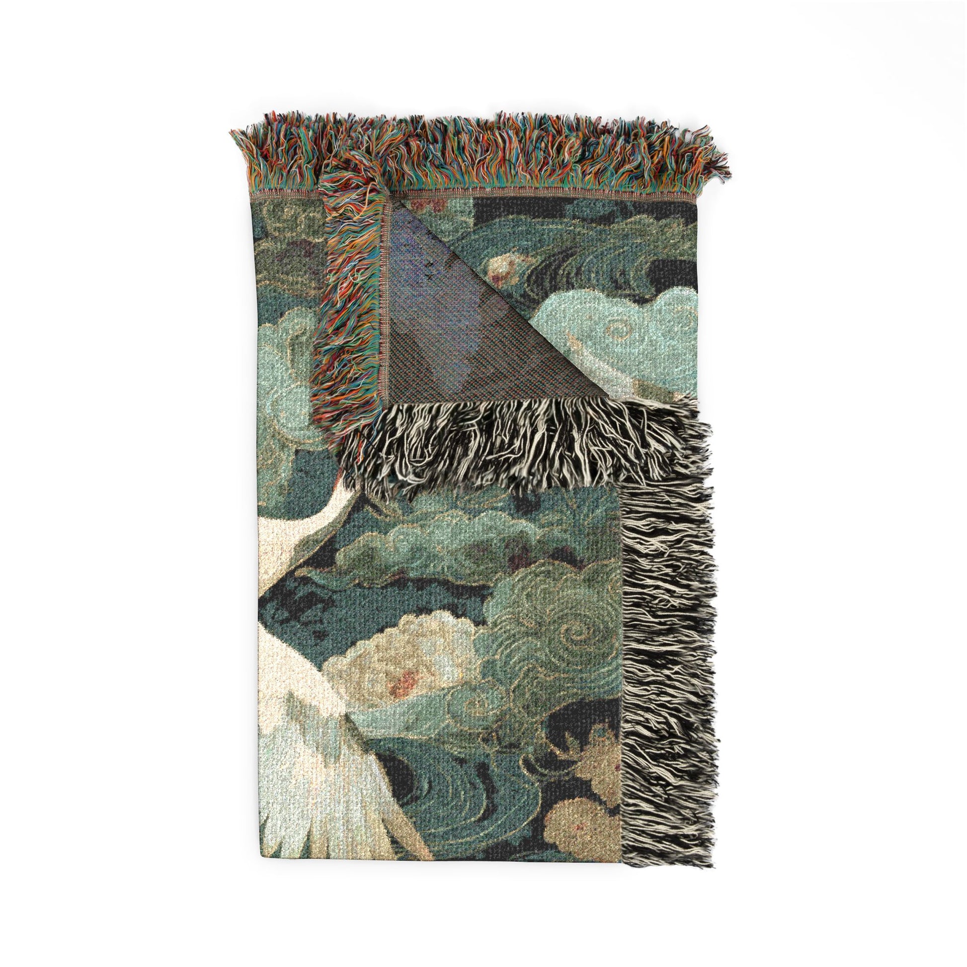 Decorative blanket with floral and bird pattern on a white background