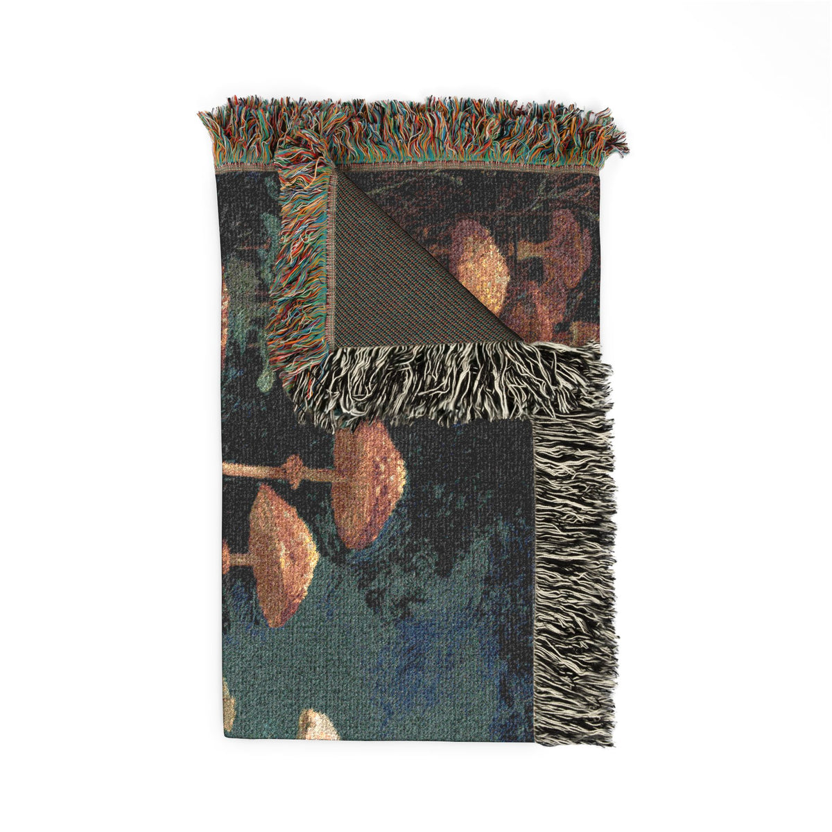 Decorative throw blanket with fringe on a white background