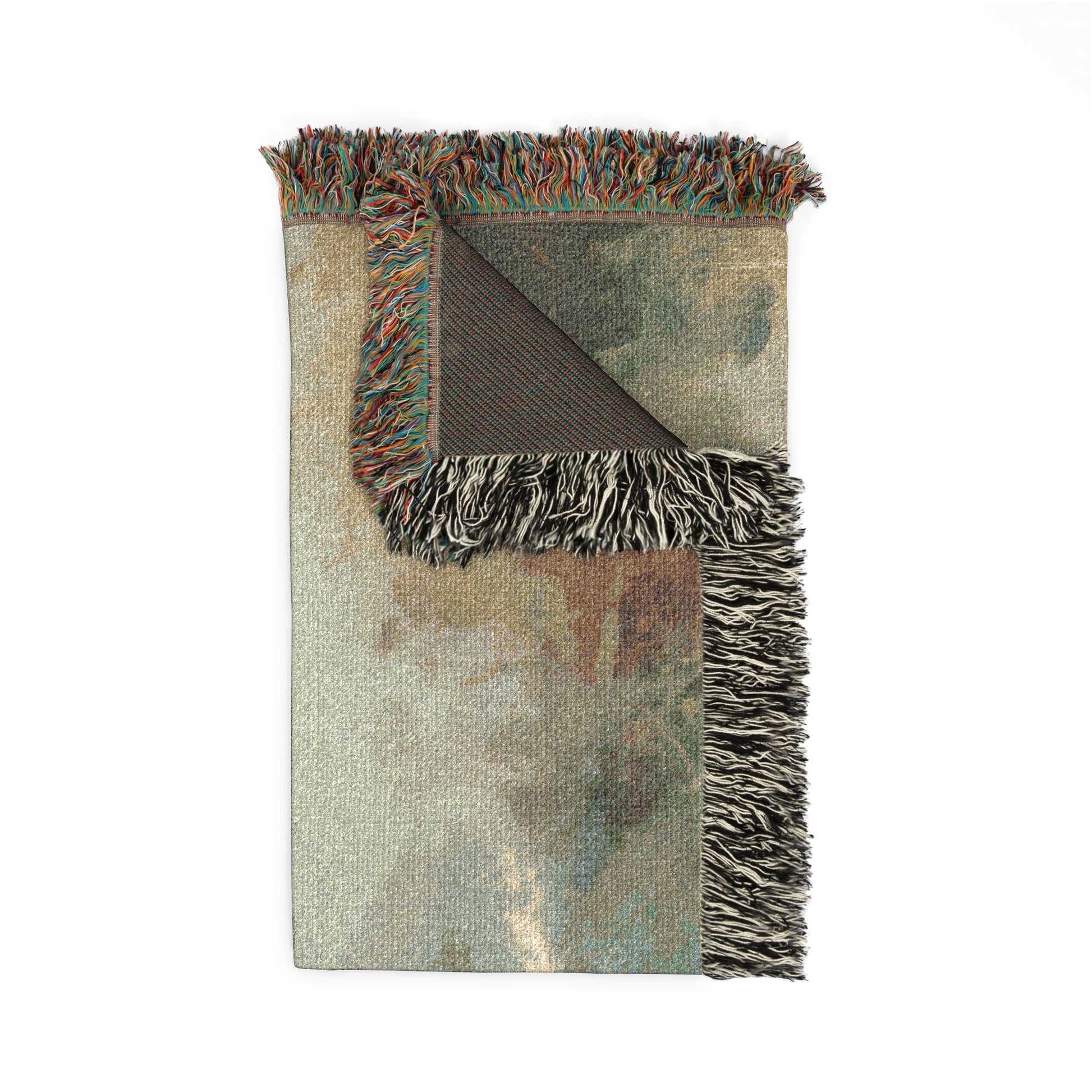 Folded blanket with fringes on a white background