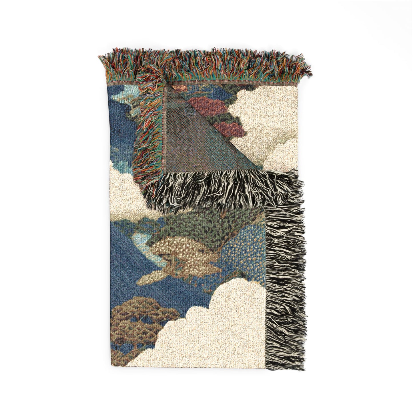Multicolored woven blanket with fringe on a white background