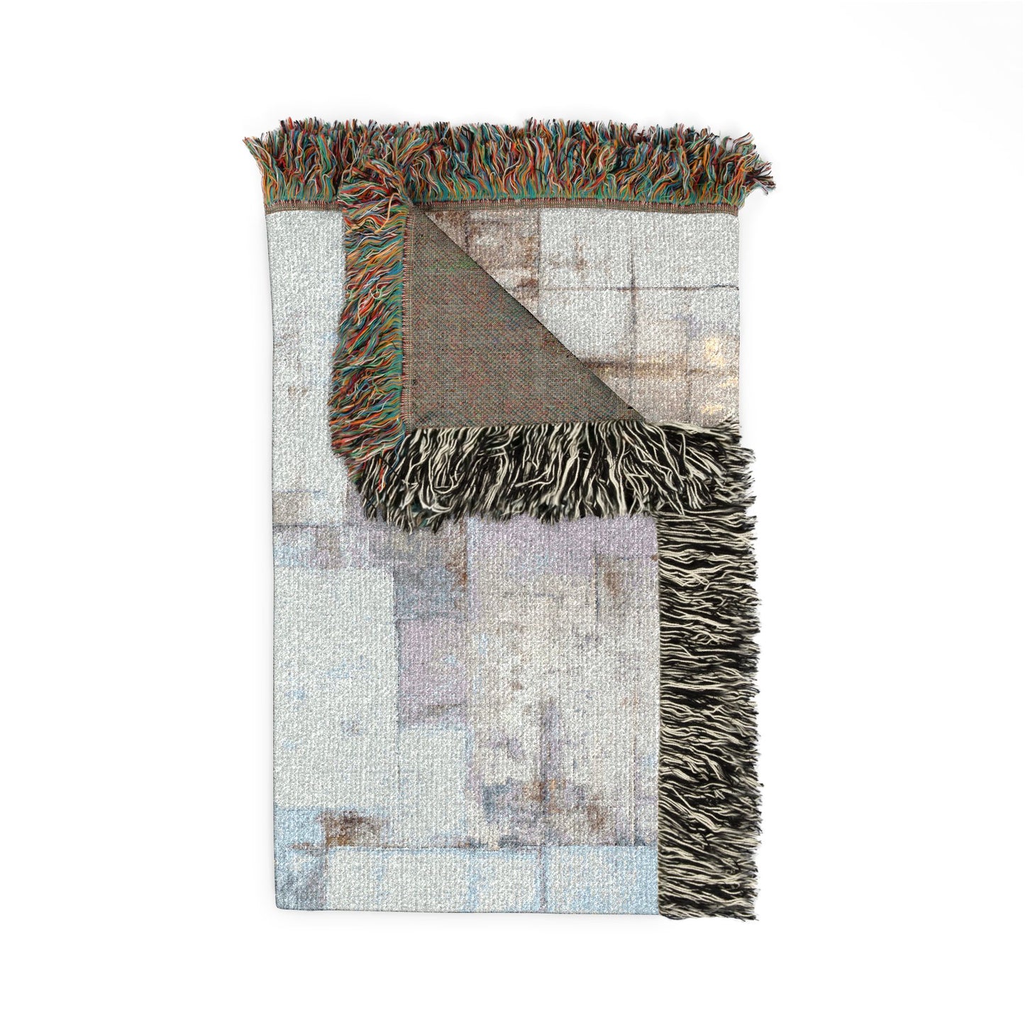 Textured area blanket with fringes on a white background