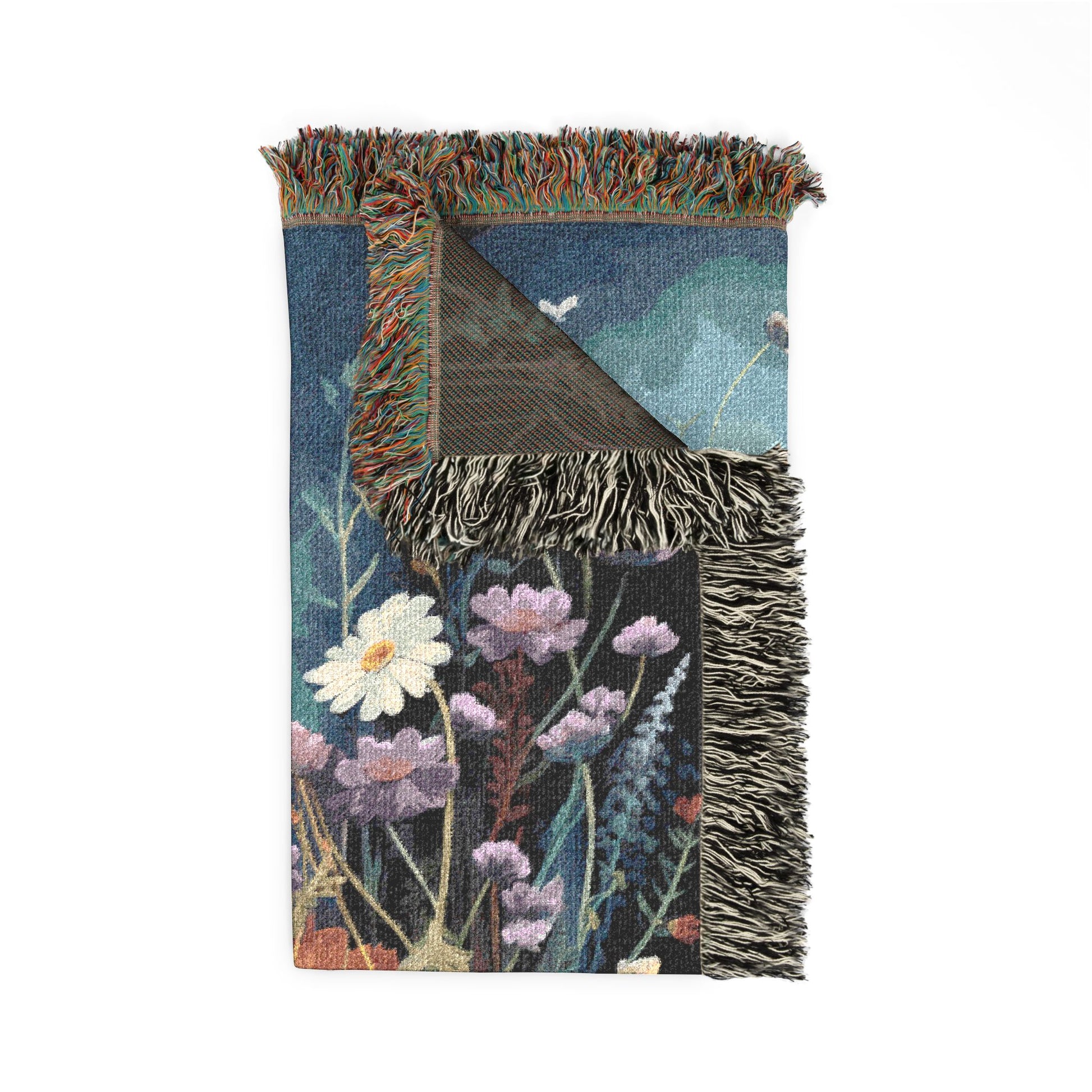 Floral-patterned blanket with fringe on a white background