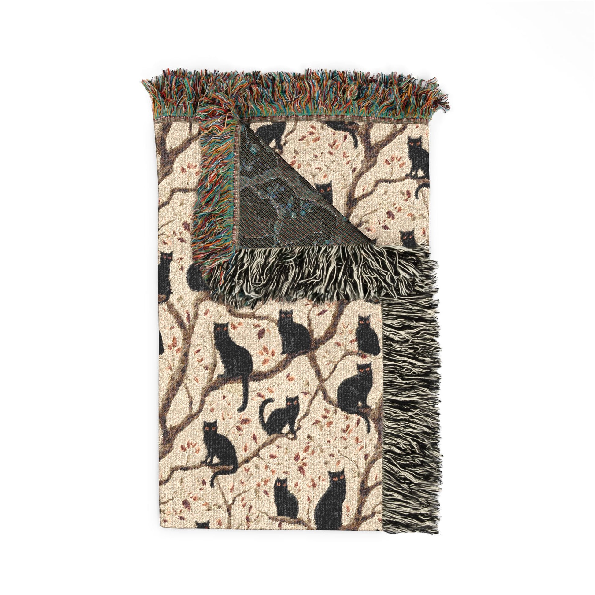 Decorative throw blanket with black cat pattern on beige background