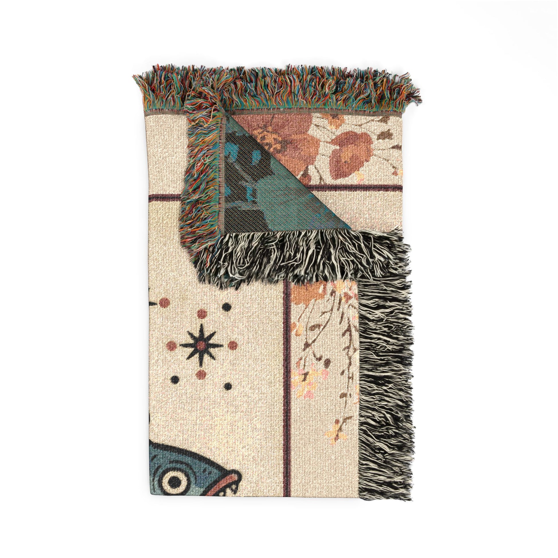 Decorative blanket with geometric pattern and fringes on a white background