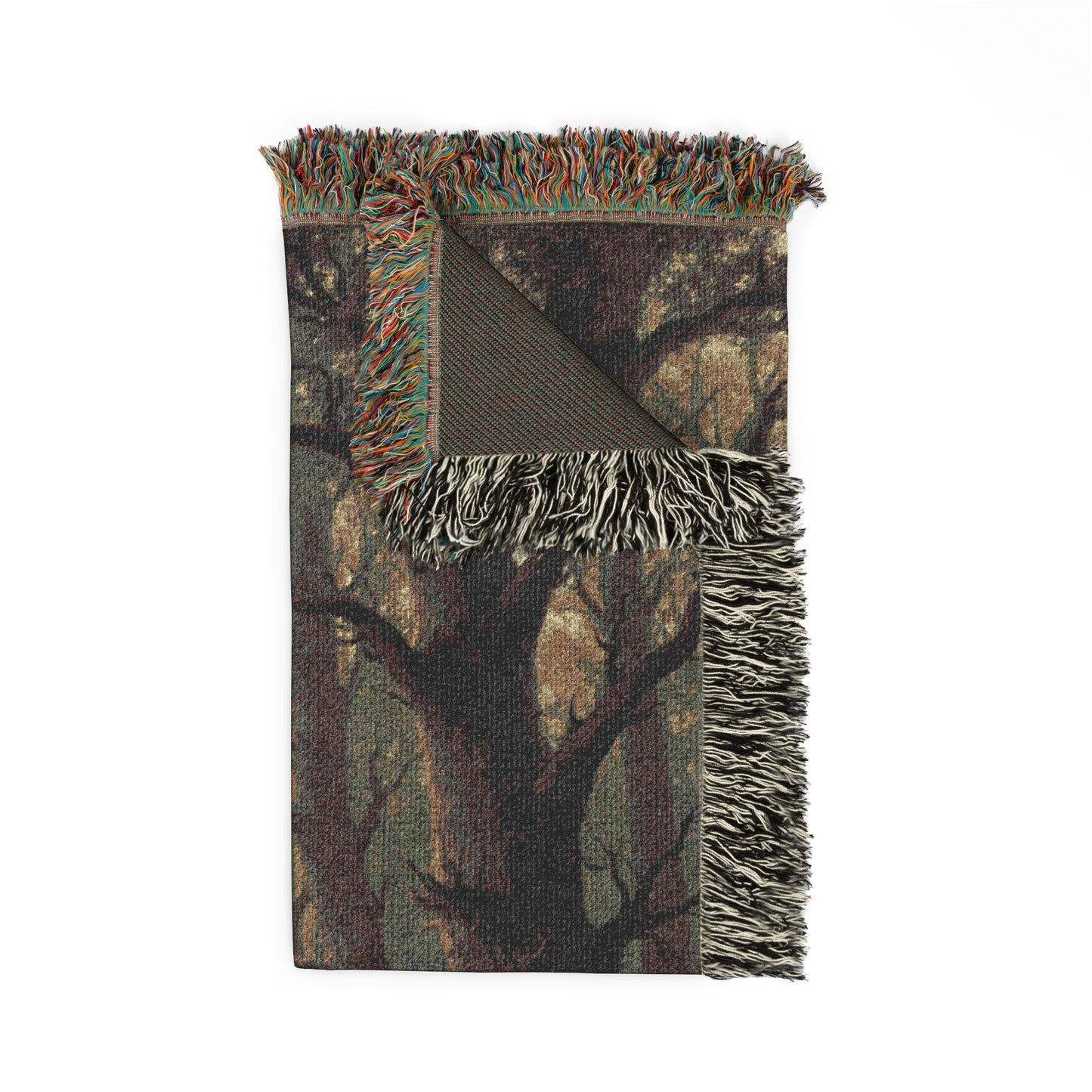 Camouflage-patterned throw blanket with fringed edges on a white background