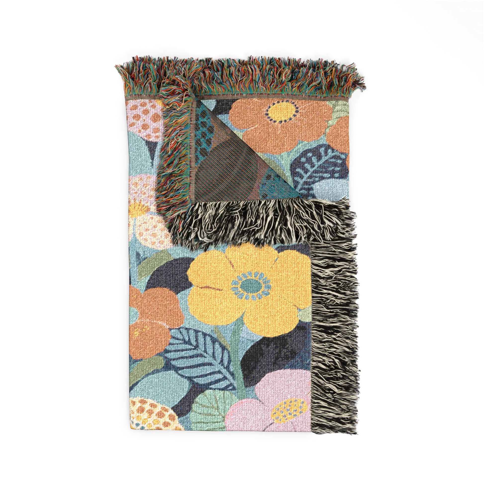 Floral patterned blanket with fringe on a white background