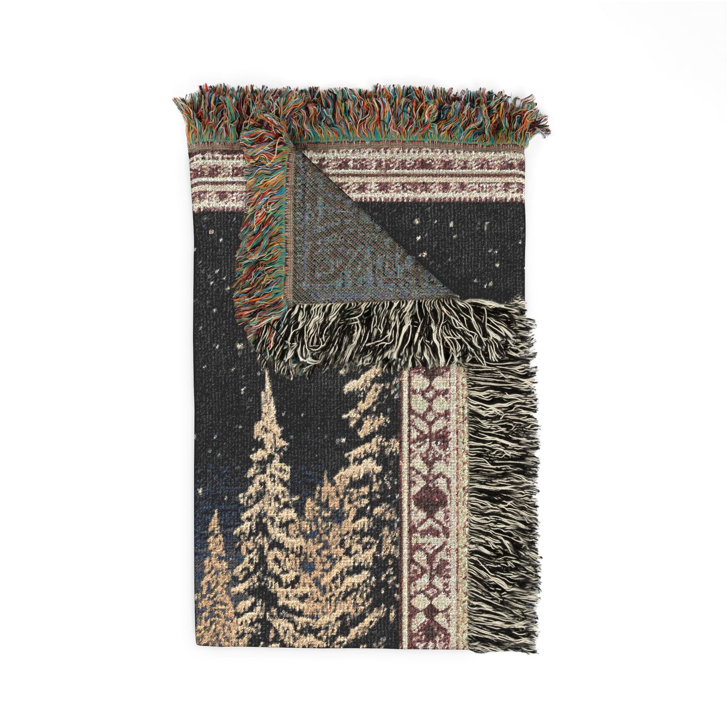 woven blanket with tree pattern and fringes on a white background