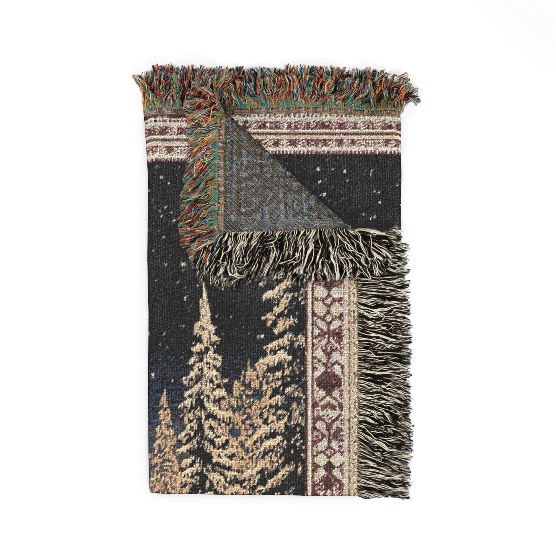 woven blanket with tree pattern and fringes on a white background
