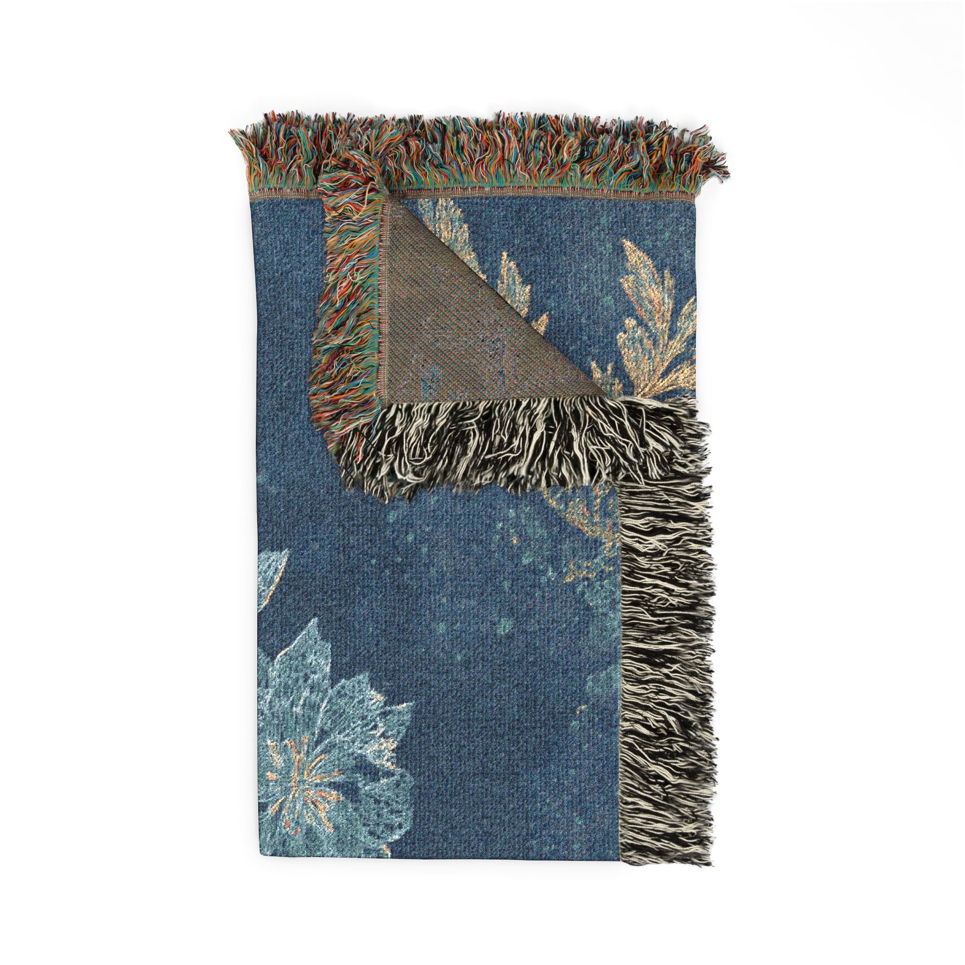 Floral-patterned blanket with fringed edges on a white background