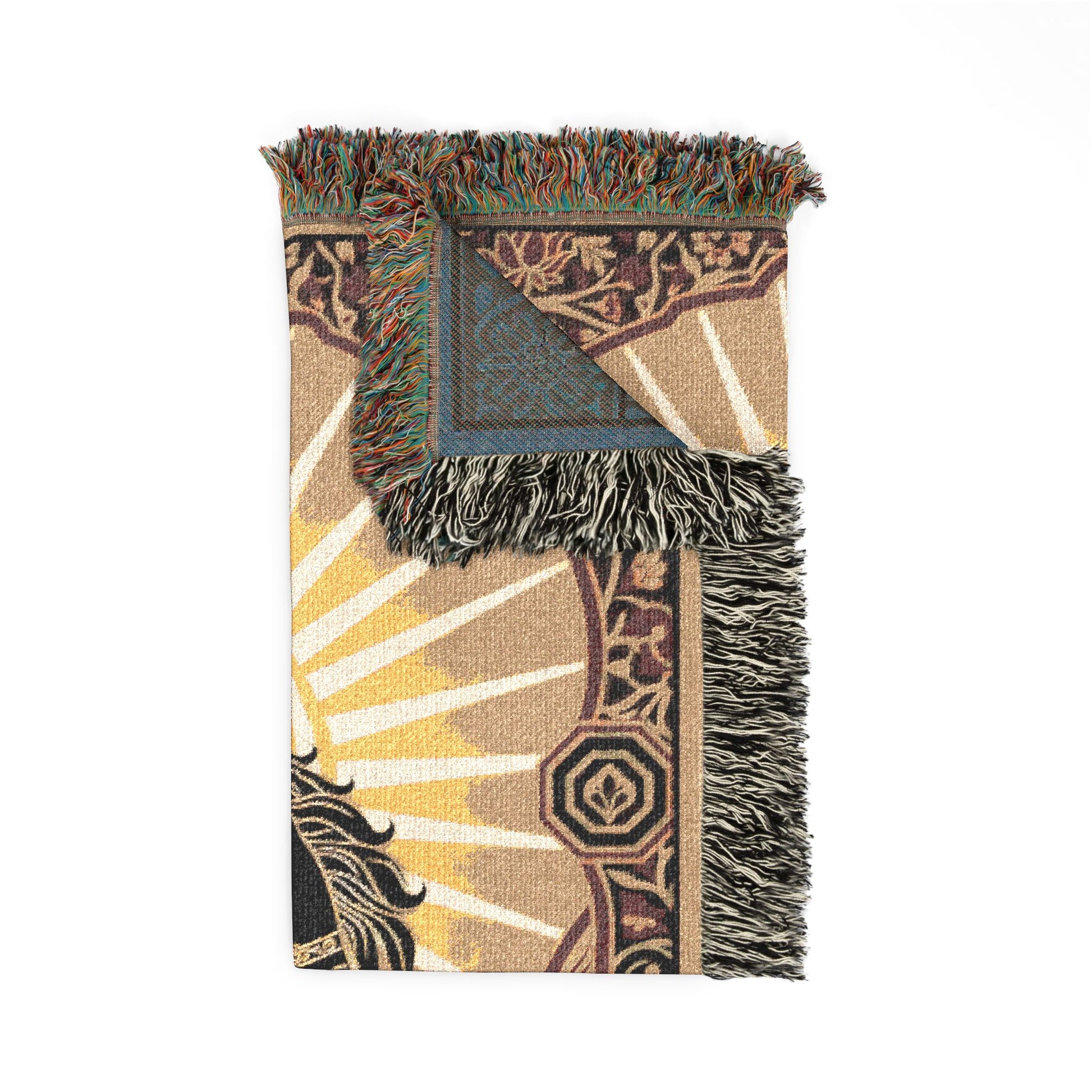 Decorative blanket with intricate patterns and fringes on a white background