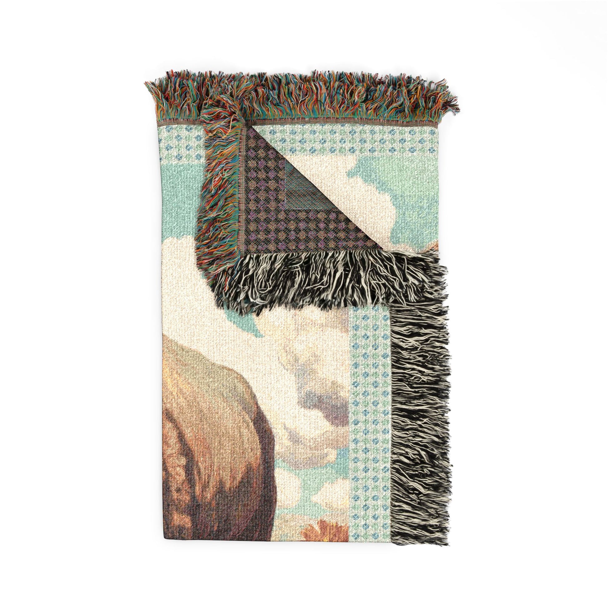 Woven blanket with fringe on a white background