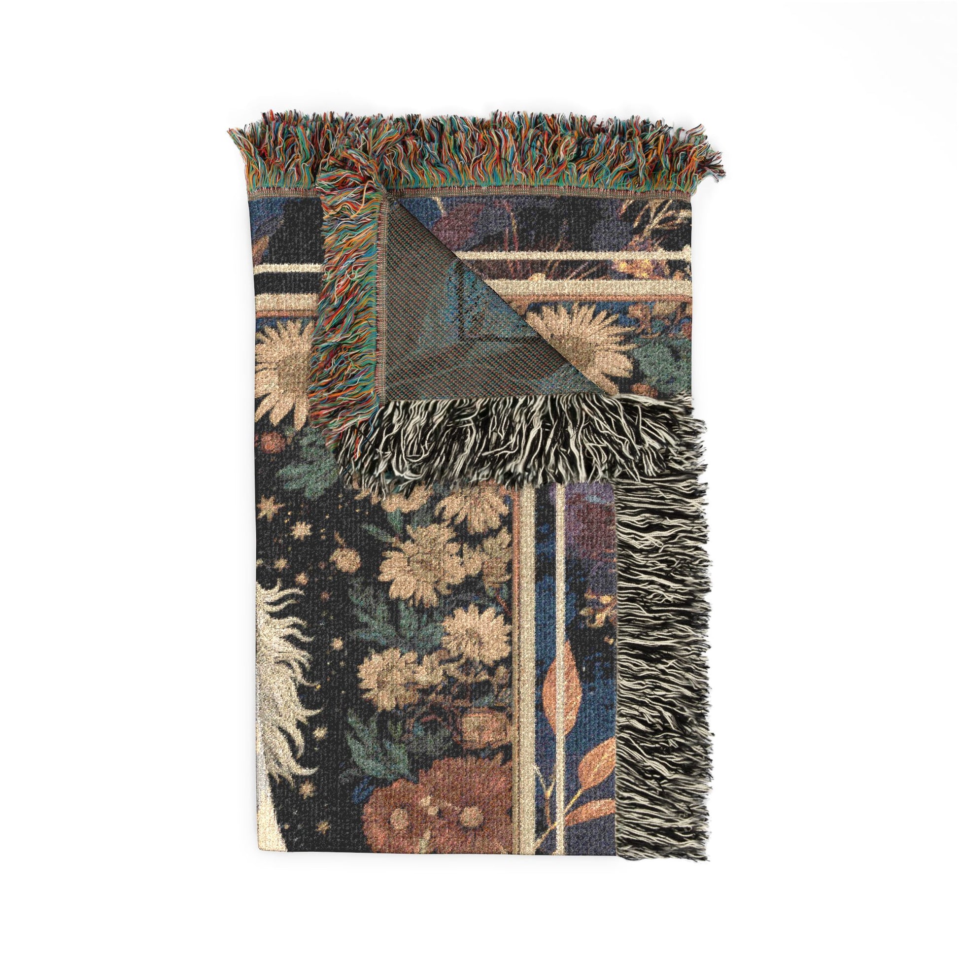 Decorative blanket with floral patterns and fringed edges on a white background