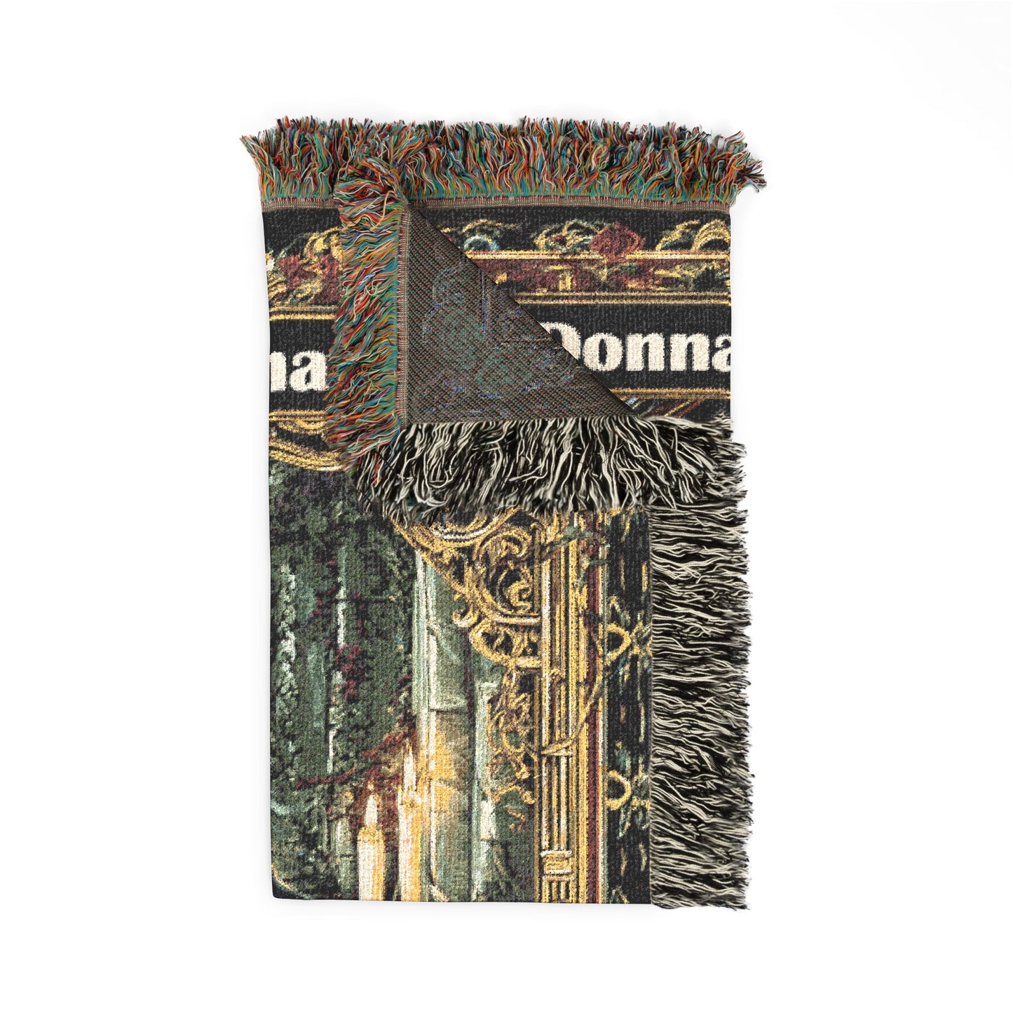 Decorative throw blanket with fringe on a white background