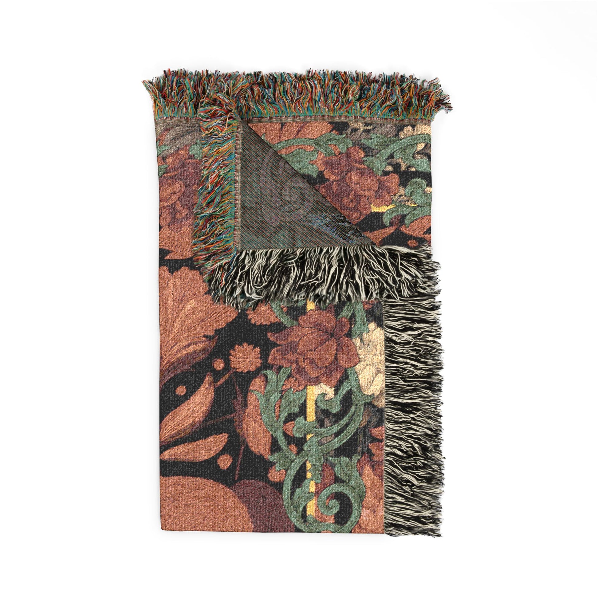 Decorative throw blanket with floral pattern and fringes on a white background