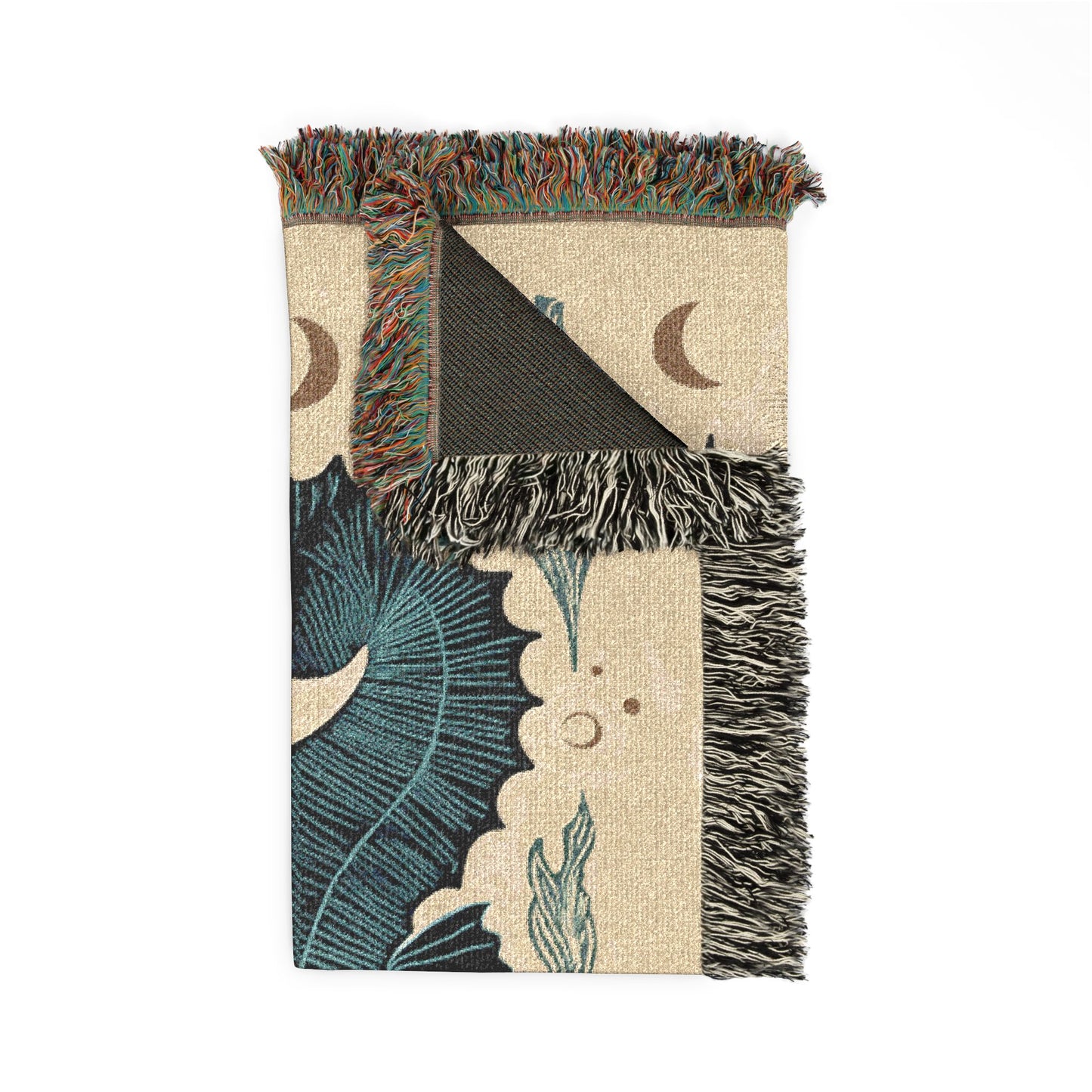 Decorative throw blanket with fringe edges and nature-themed design on a white background