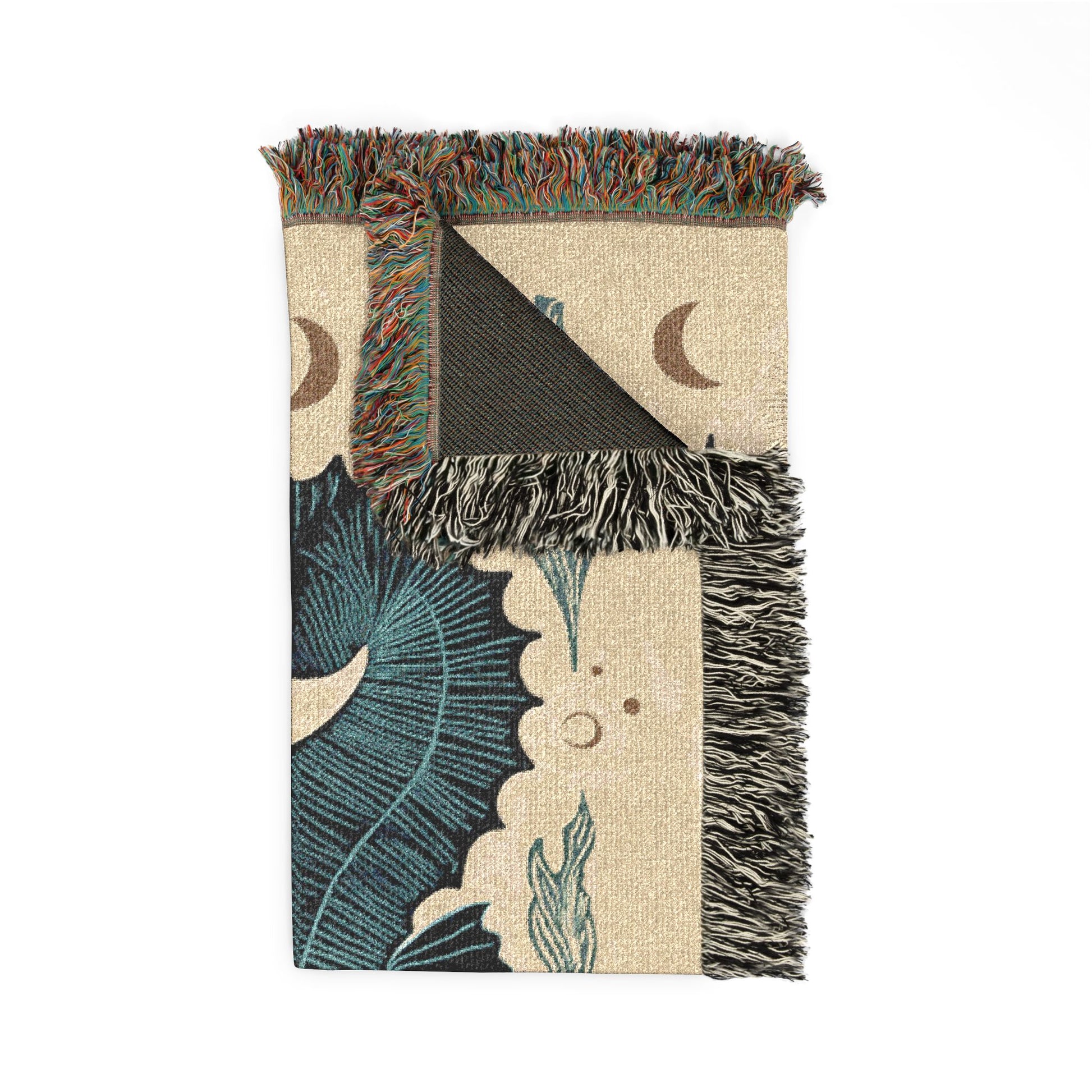 Decorative throw blanket with fringe edges and nature-themed design on a white background