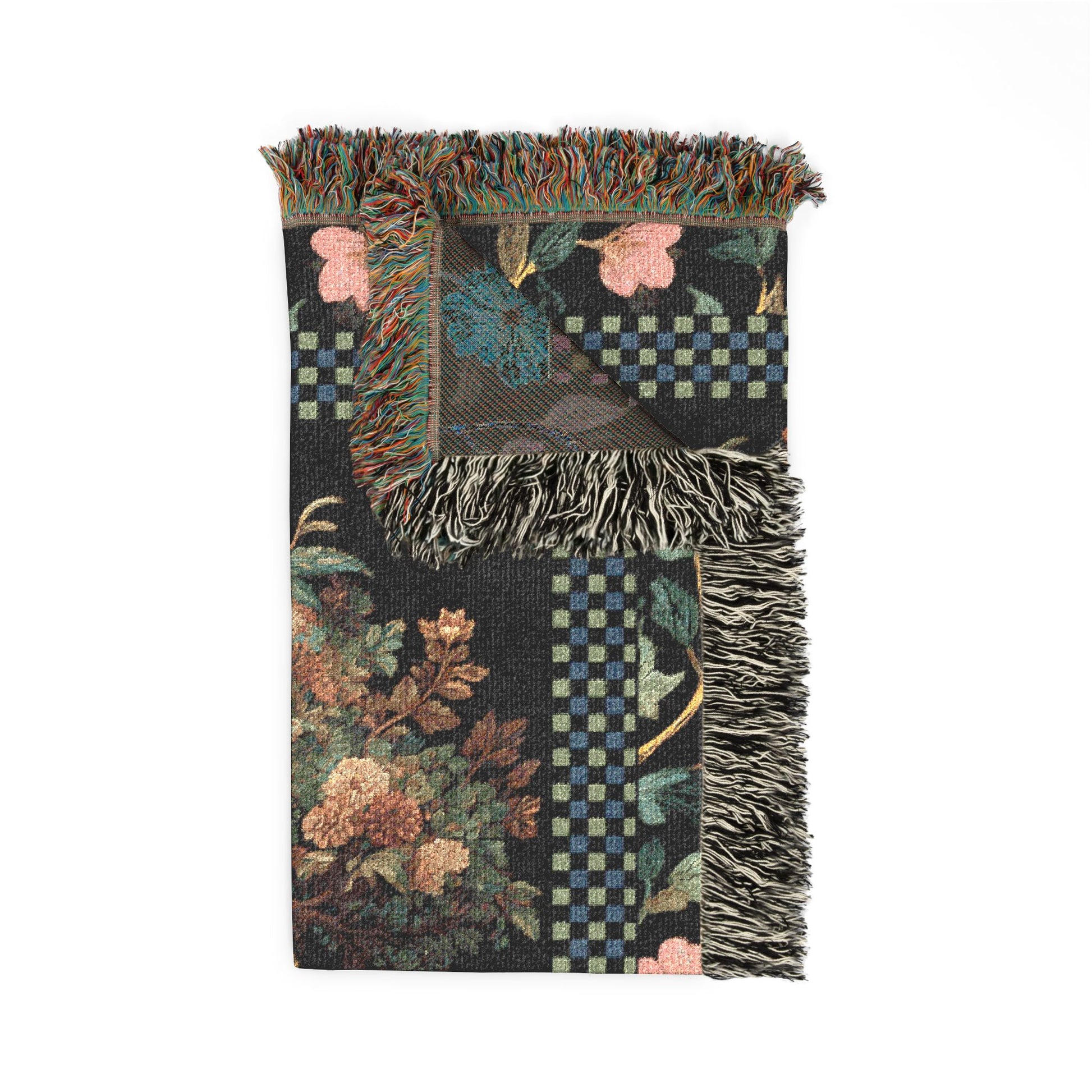 Decorative throw blanket with floral and checkered patterns on a white background