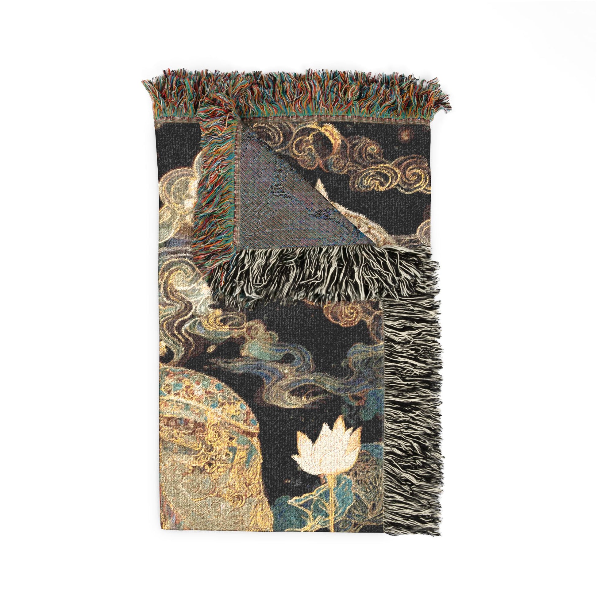 Decorative throw blanket with intricate patterns and fringes on a white background