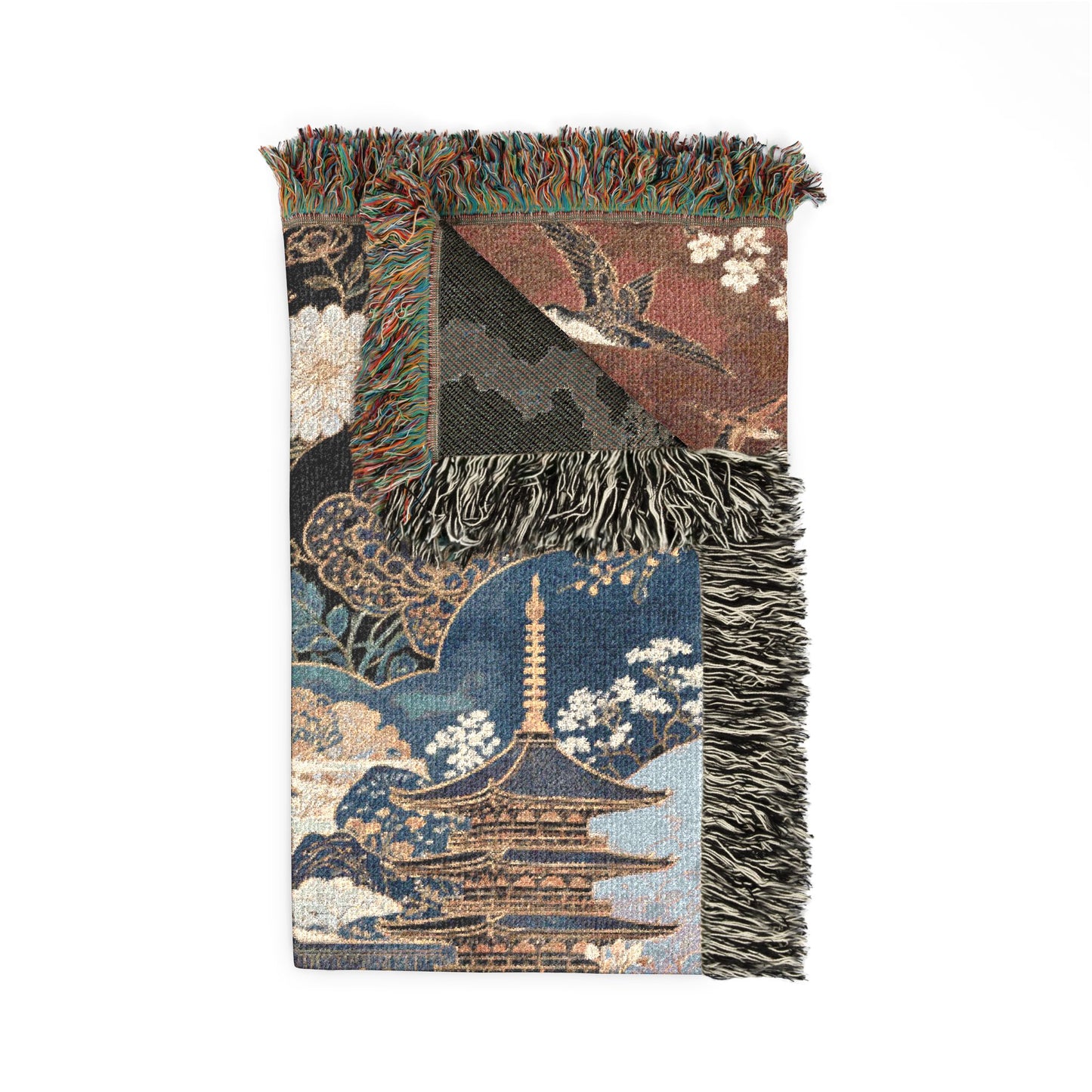 Decorative throw blanket with Japanese-inspired design featuring a pagoda and floral patterns on a white background.
