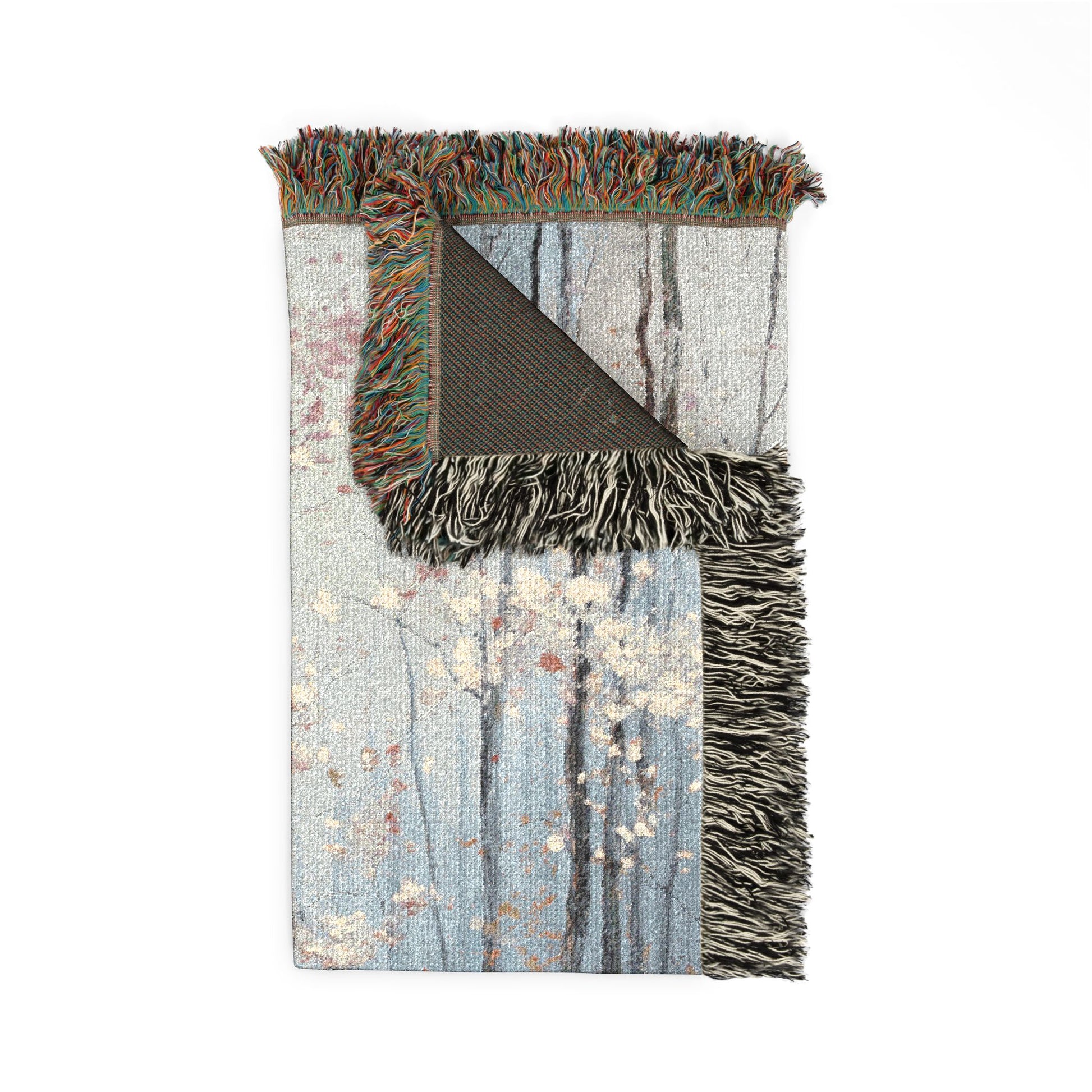 Blanket with fringed edge on a white background