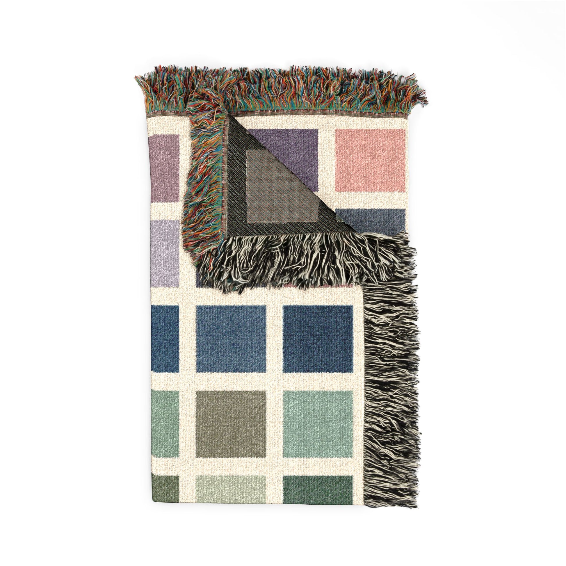 Multicolored checkered blanket with fringed edges on a white background