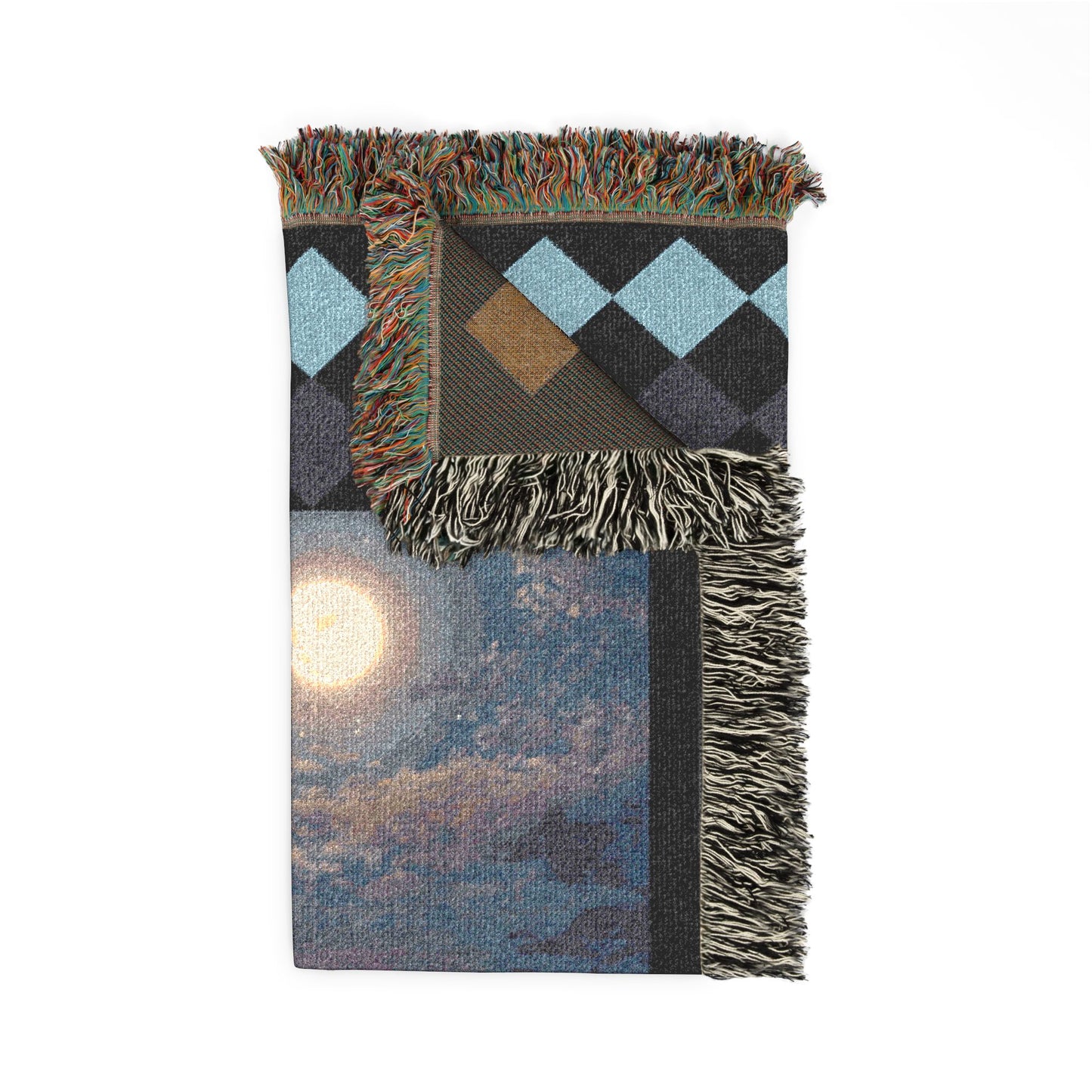 Woven blanket with geometric pattern and fringed edges on a white background