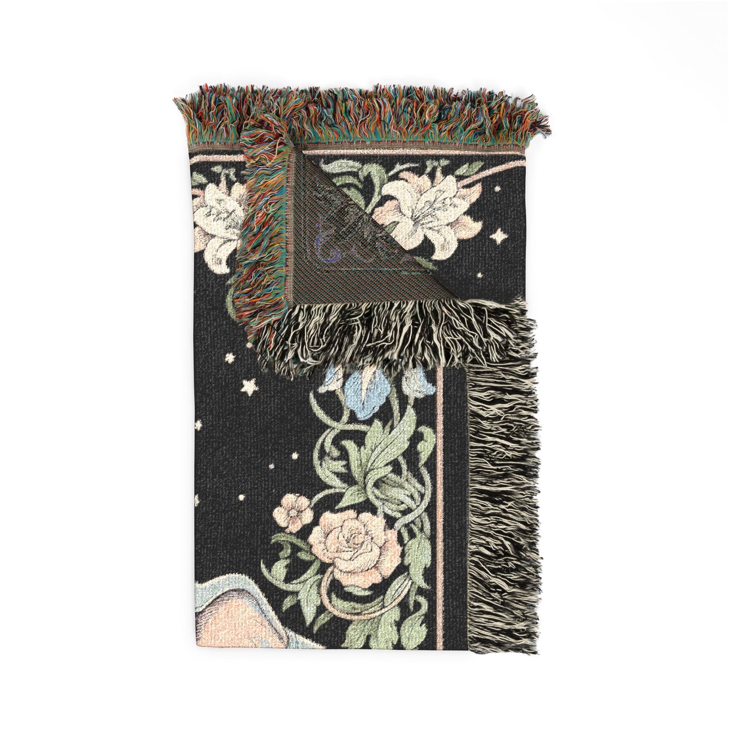 Decorative throw blanket with floral patterns and fringes on a white background