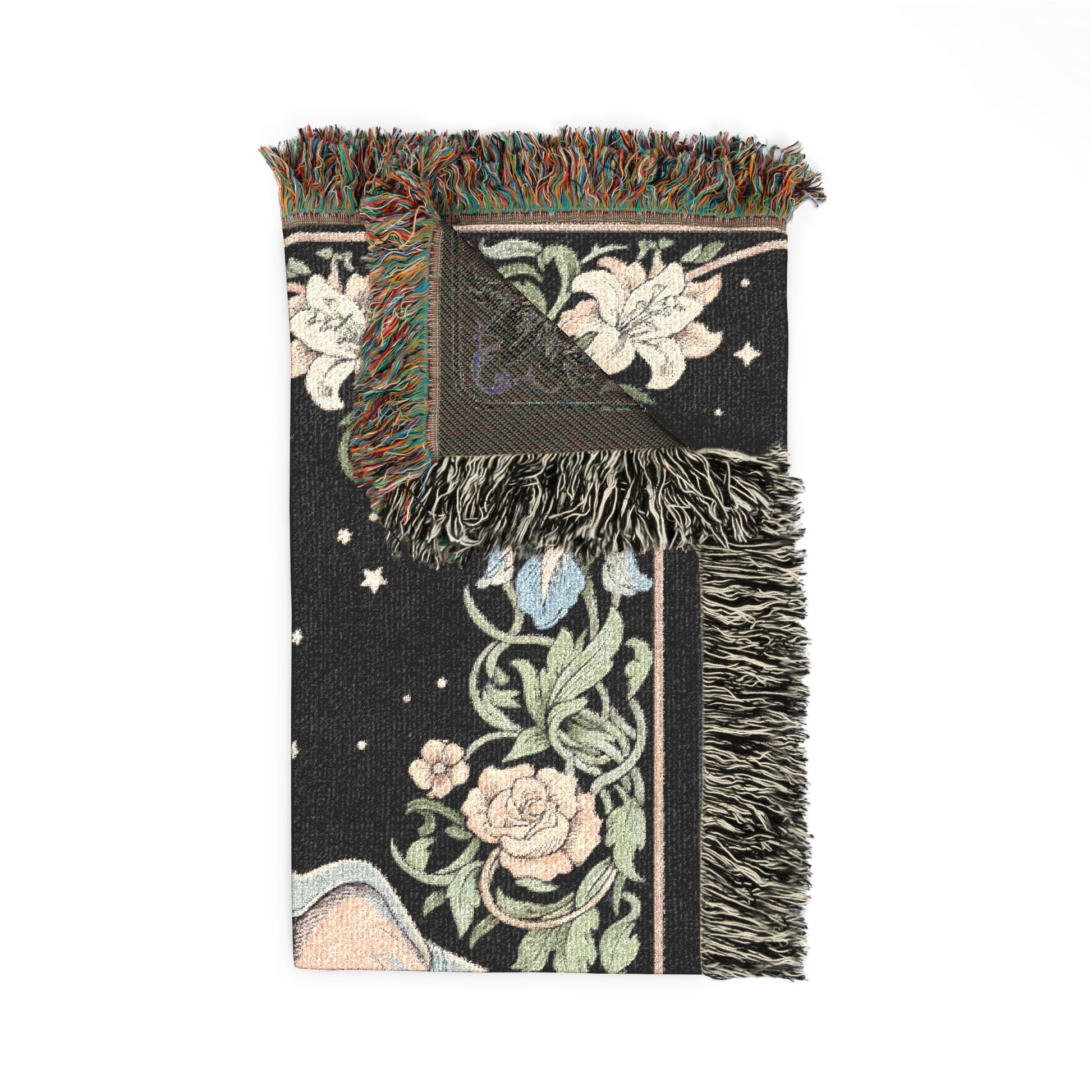 Decorative throw blanket with floral patterns and fringes on a white background