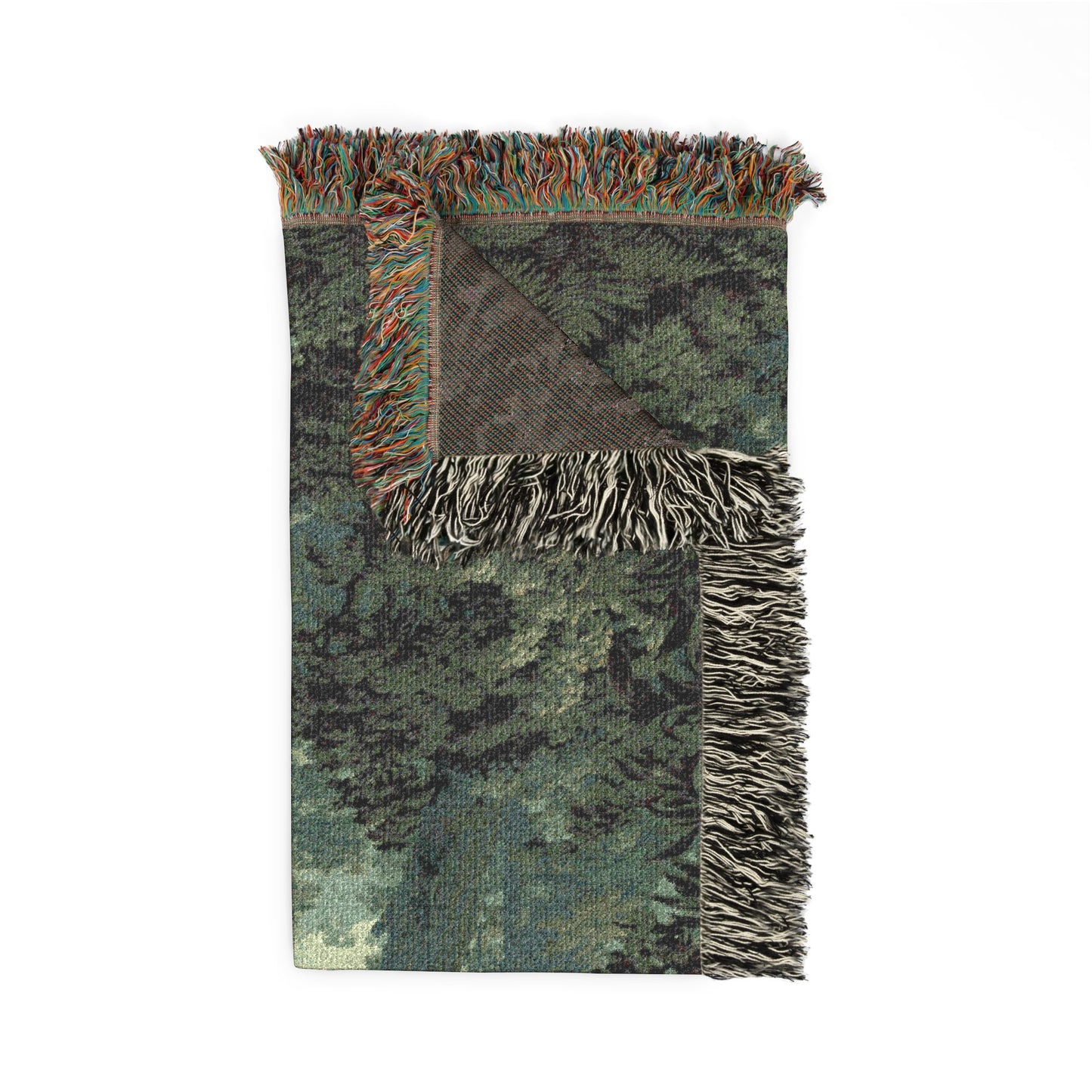 A rectangular woven throw blanket with a forest camouflage pattern in shades of green, gray, and black, featuring fringed edges and a reverse side with a different pattern, shown on a plain white background.