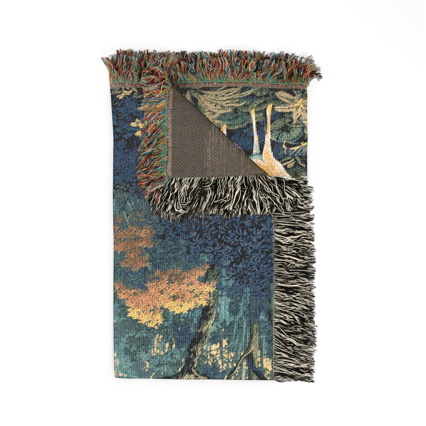 A woven throw blanket with a forest landscape pattern in shades of blue, green, orange, and beige, featuring fringed edges and a dark brown reverse side, shown on a plain white background.