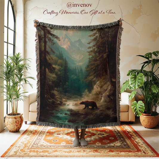 Woven blanket with bear and forest design displayed in a room with plants and furniture.
